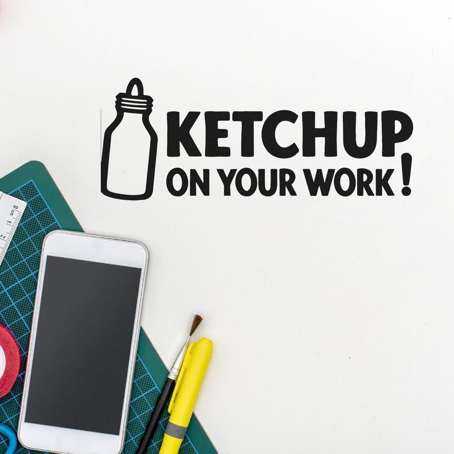 Black ketchup bottle logo stamp reading KETCHUP ON YOUR WORK! on white background with craft tools.