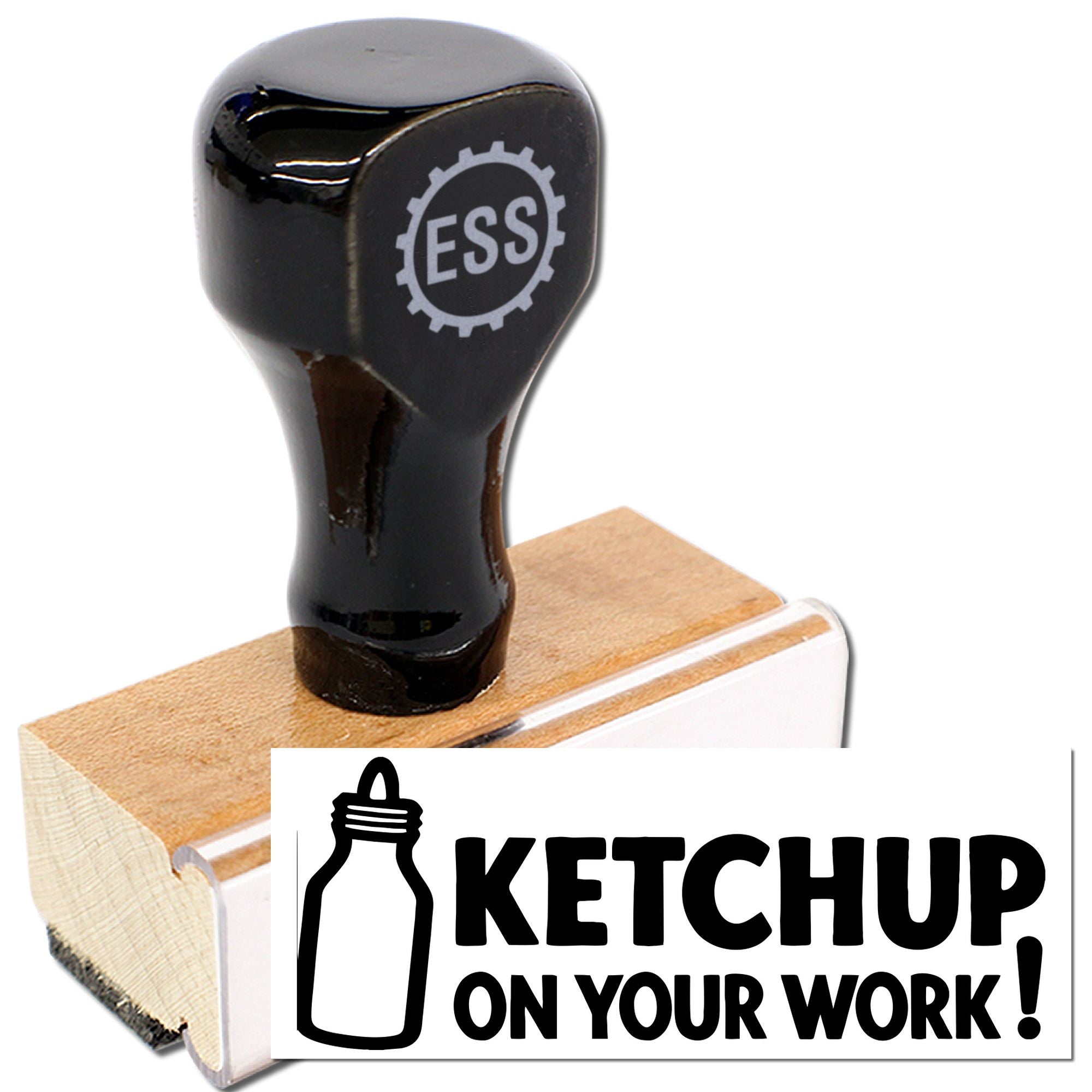 Black rubber stamp on a wooden base with ESS logo and white KETCHUP ON YOUR WORK! seal graphic.