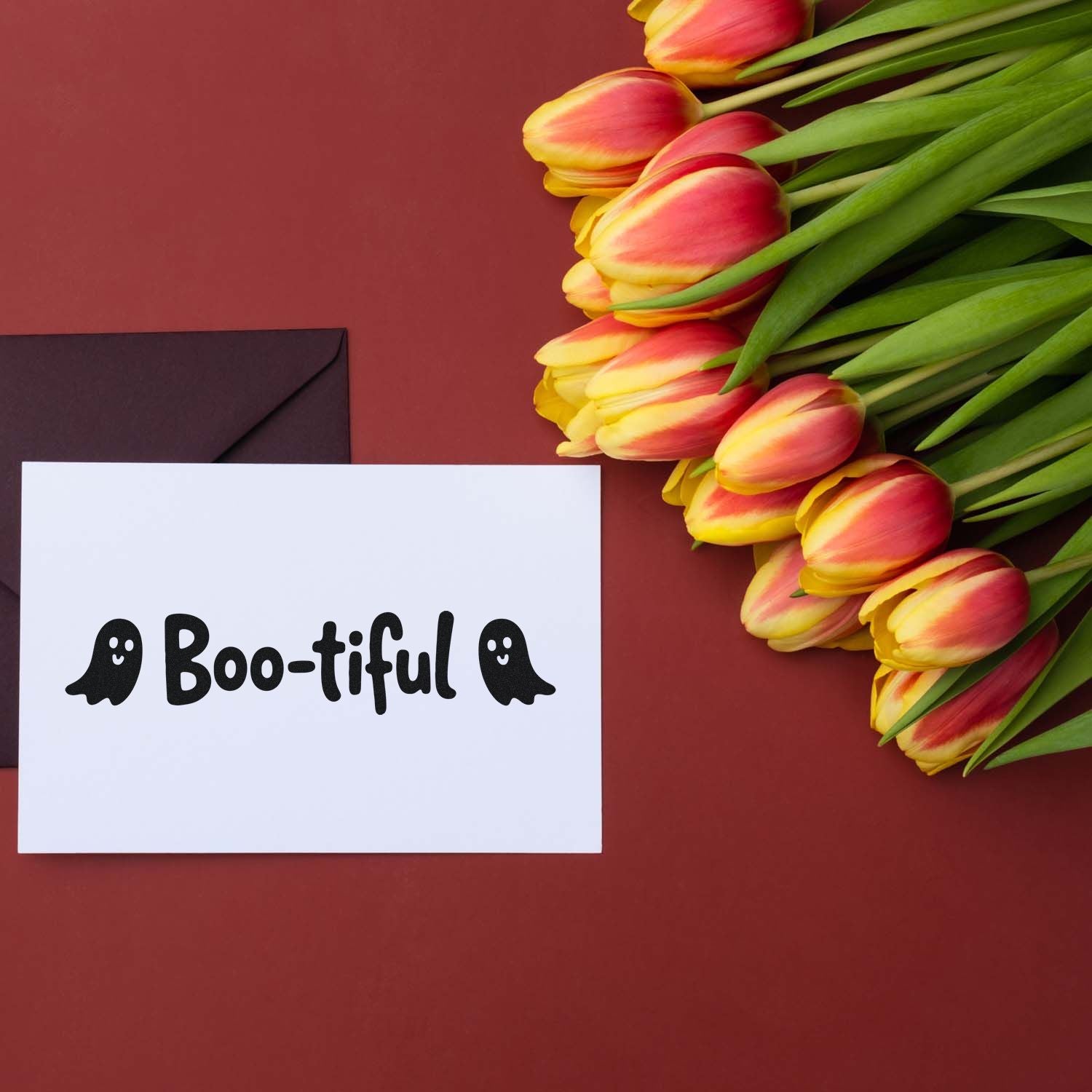 Boo-tiful Halloween stamp and seal card with black envelope and pink-yellow tulips on a burgundy background