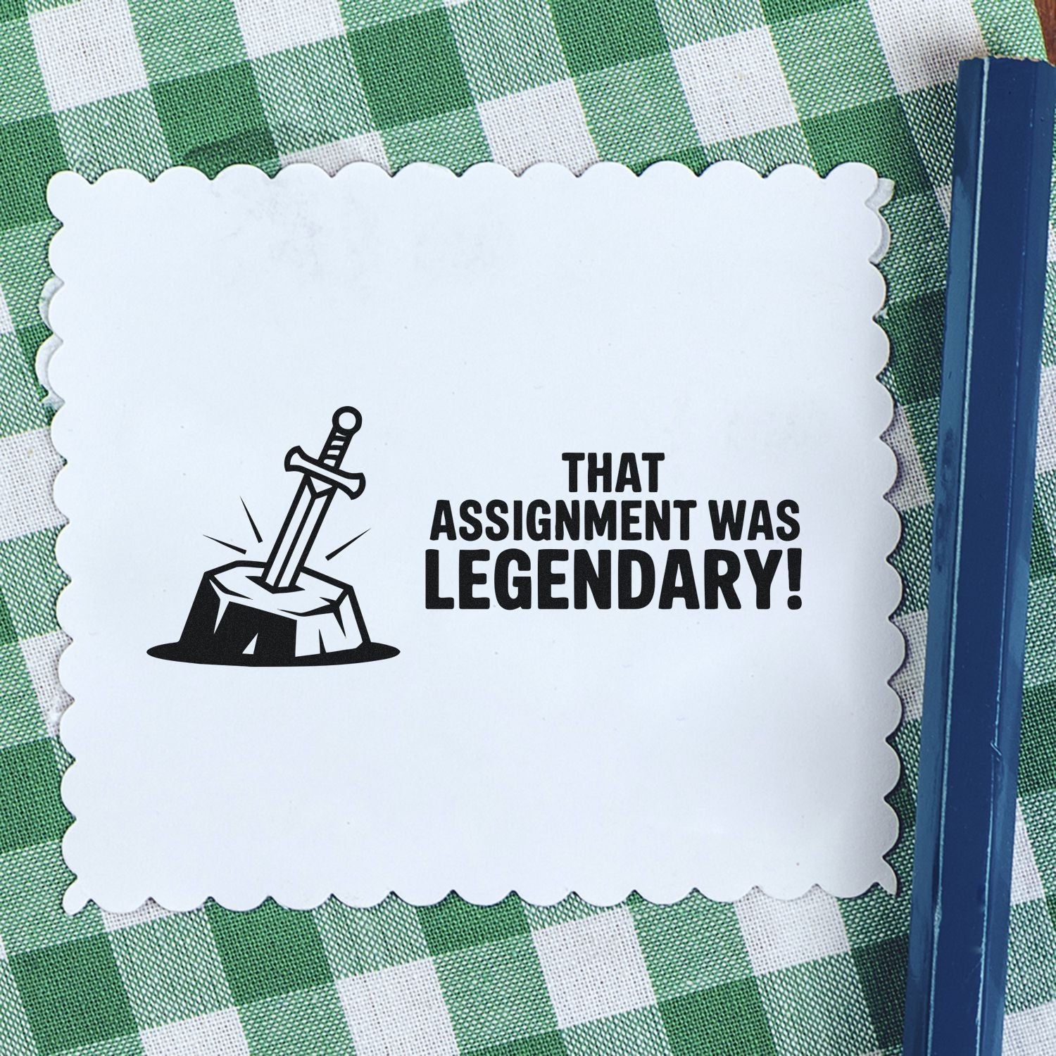 White scalloped stamp seal with black sword-in-stone icon and That assignment was legendary! on a green checkered background.