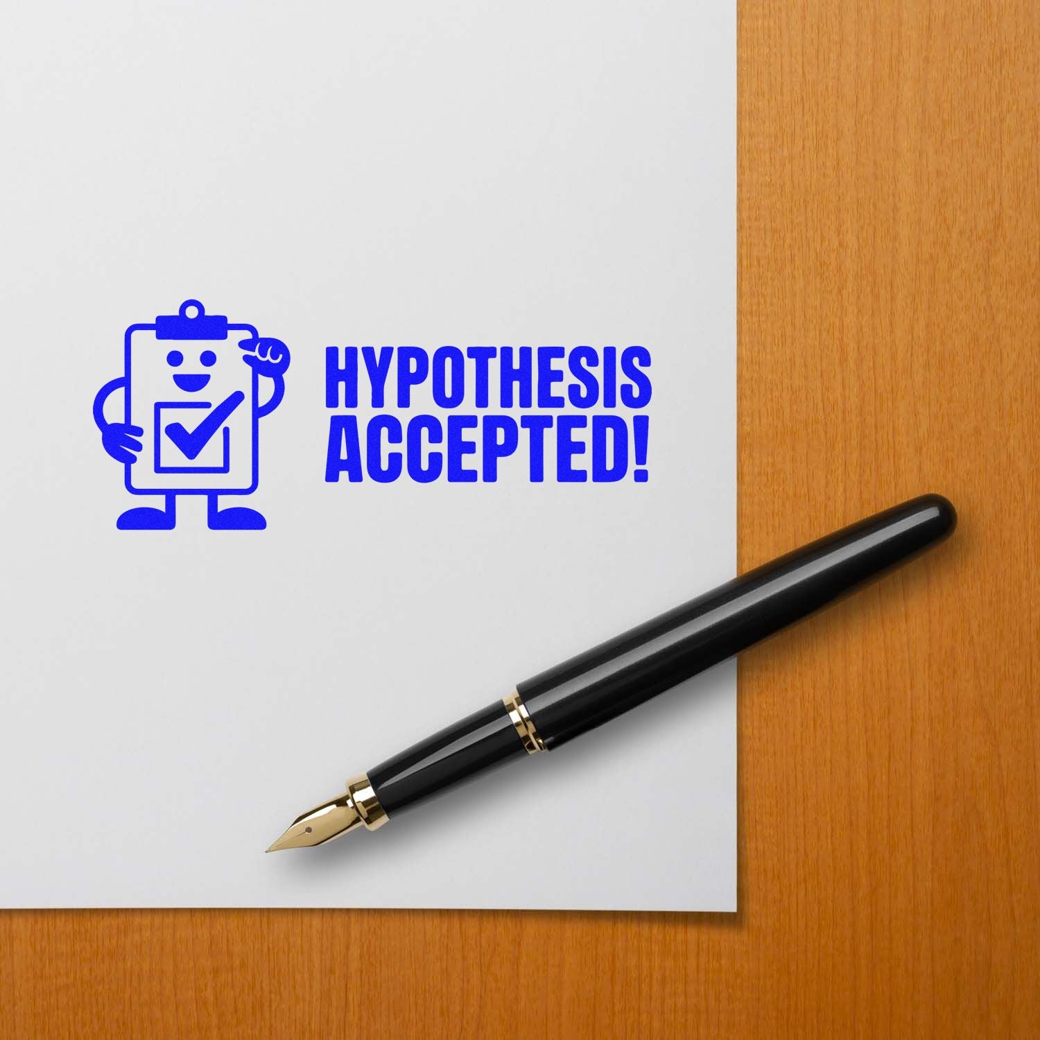 Blue Hypothesis Accepted! stamp with clipboard icon on white paper, beside a black fountain pen on a wood desk.