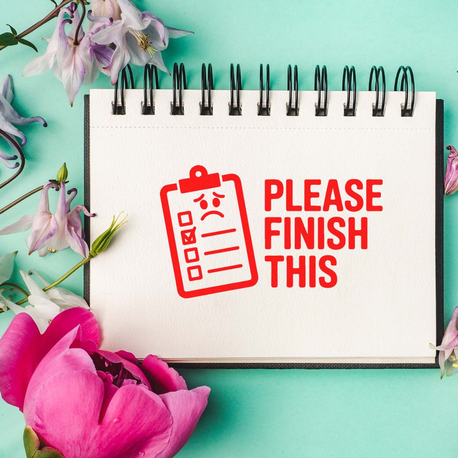 Red Please Finish This checklist stamp on a white spiral notebook with flowers on a mint green background