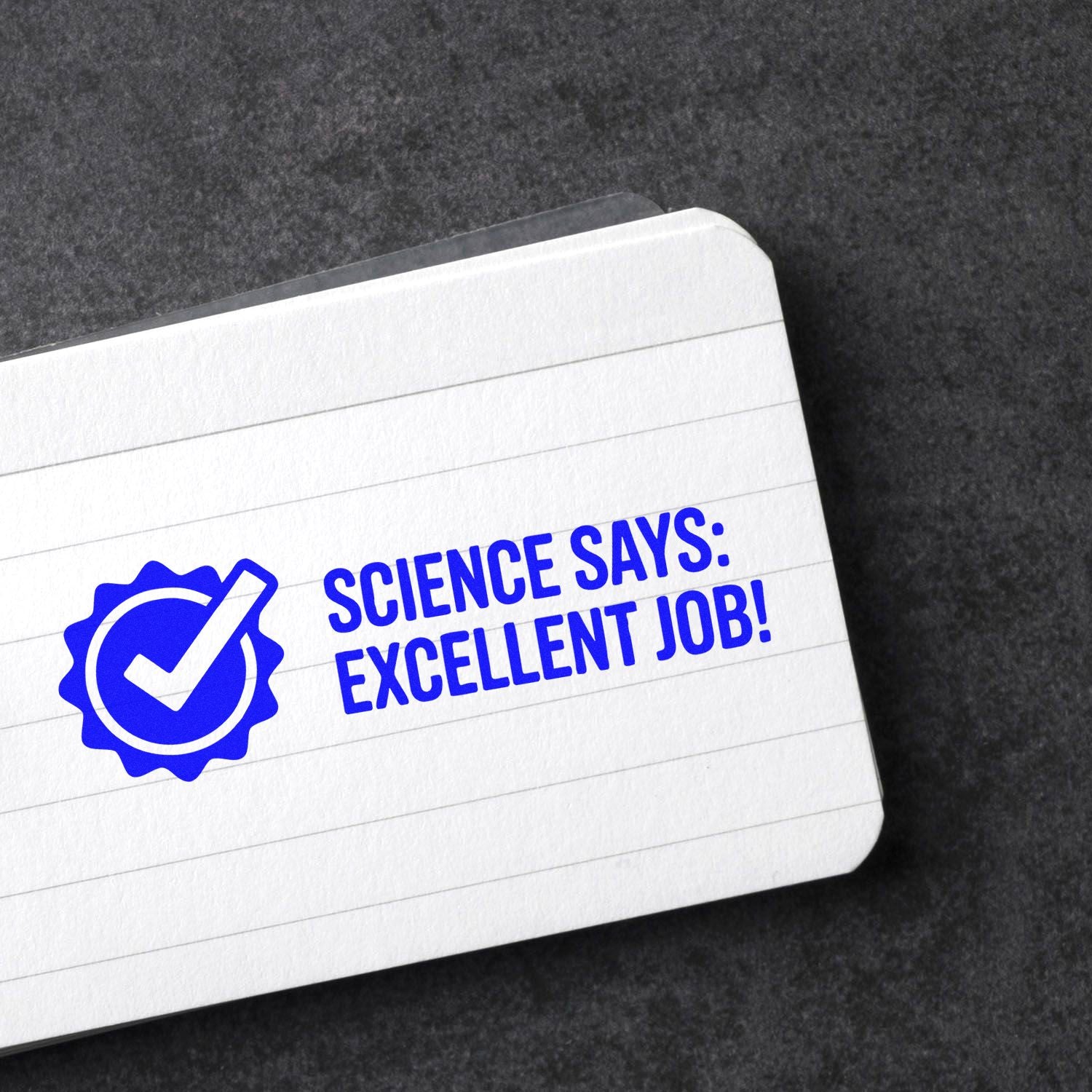 Blue science stamp and seal with checkmark and Science says: excellent job! on a white lined card.
