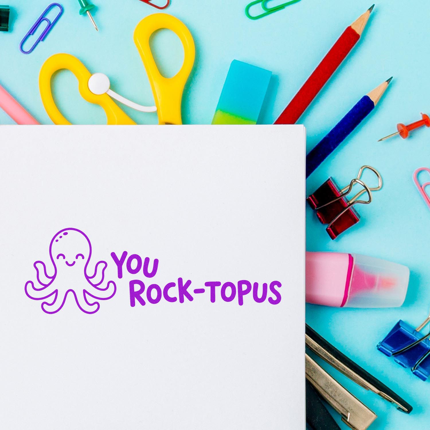 White card with purple octopus stamp reading You Rock-topus, surrounded by colorful stamp and seal stationery.