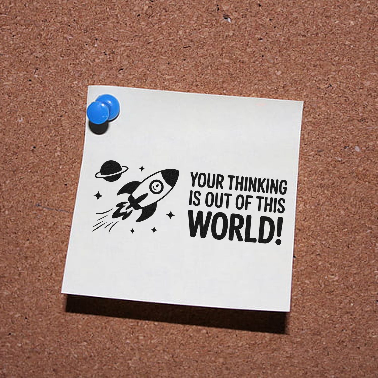 Space-themed stamp and seal design on white card with blue pushpins, black rocket, and Your thinking is out of this world!