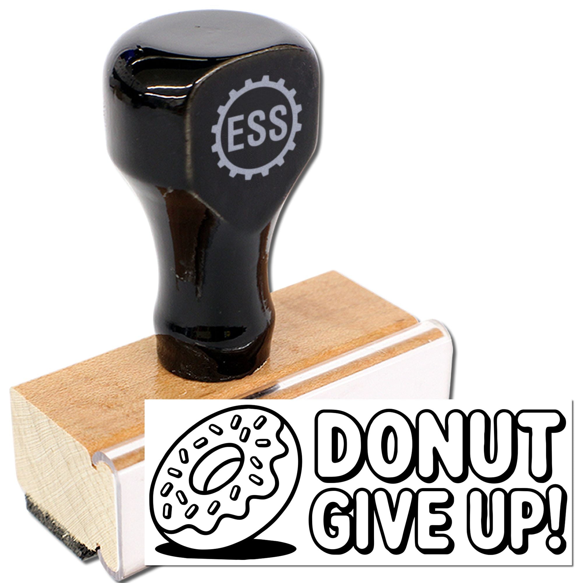 Black ESS rubber stamp and wooden seal with donut DONUT GIVE UP! design on white background