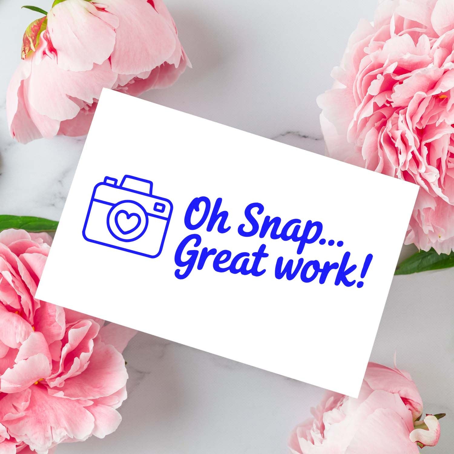 Blue camera stamp and seal with Oh Snap... Great work! on white card, surrounded by pink peonies.