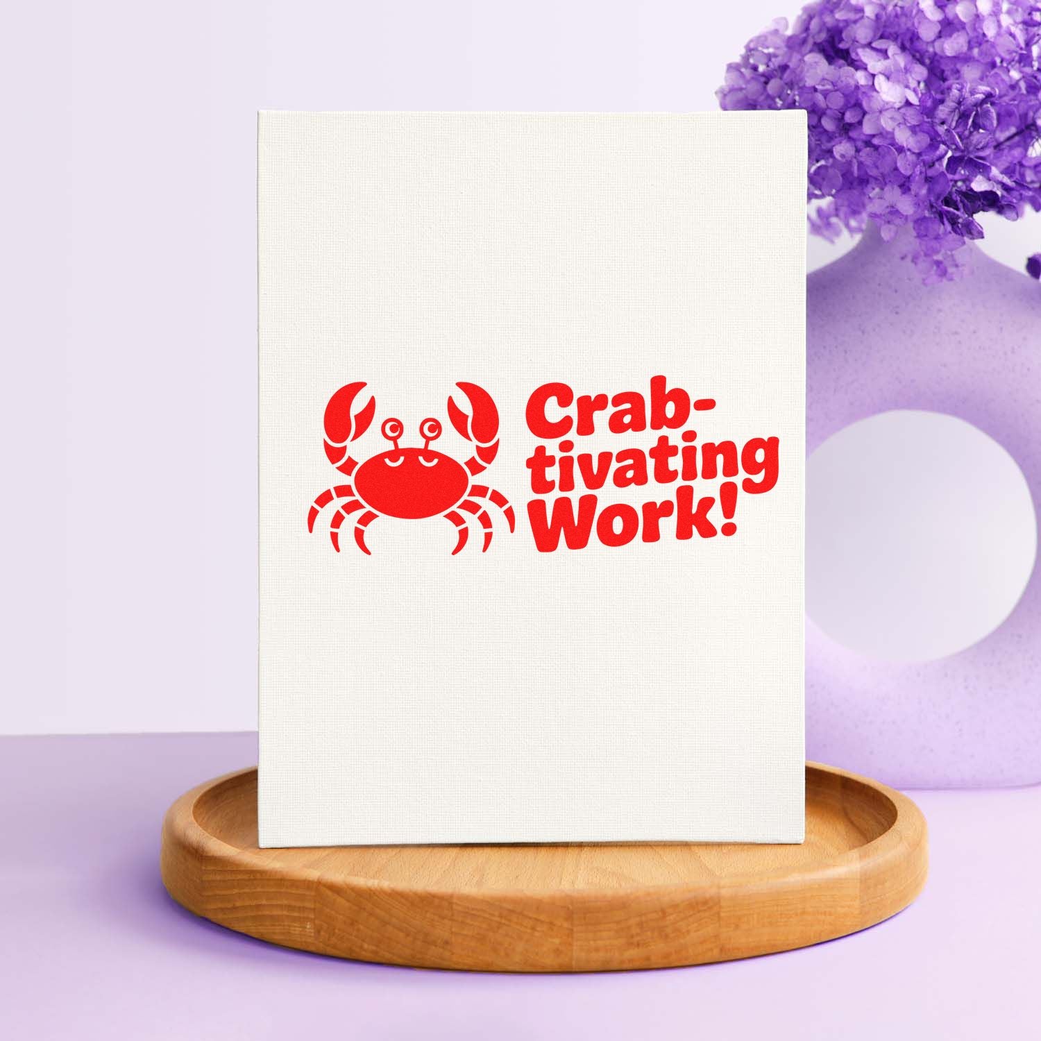Red crab stamp and seal design with Crab-tivating Work! on white canvas, set against a purple floral background.