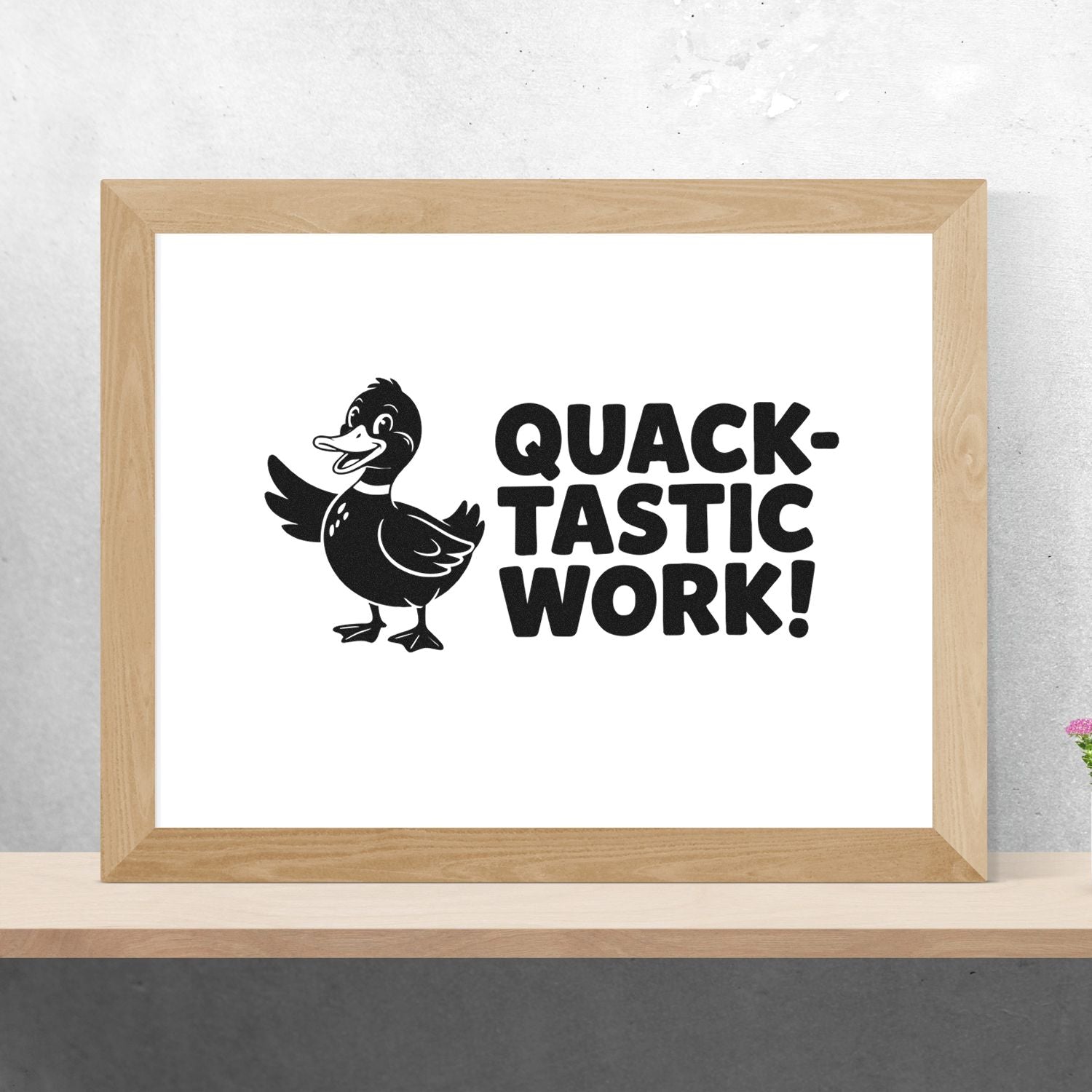 Black rubber stamp and seal design with duck and QUACK-TASTIC WORK! in a light wood frame on white.