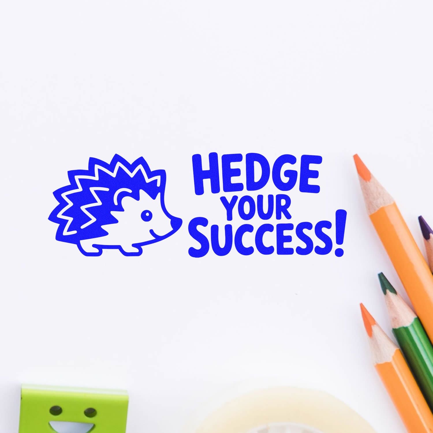Blue hedgehog stamp and seal reading HEDGE YOUR SUCCESS! on a white background with colored pencils.