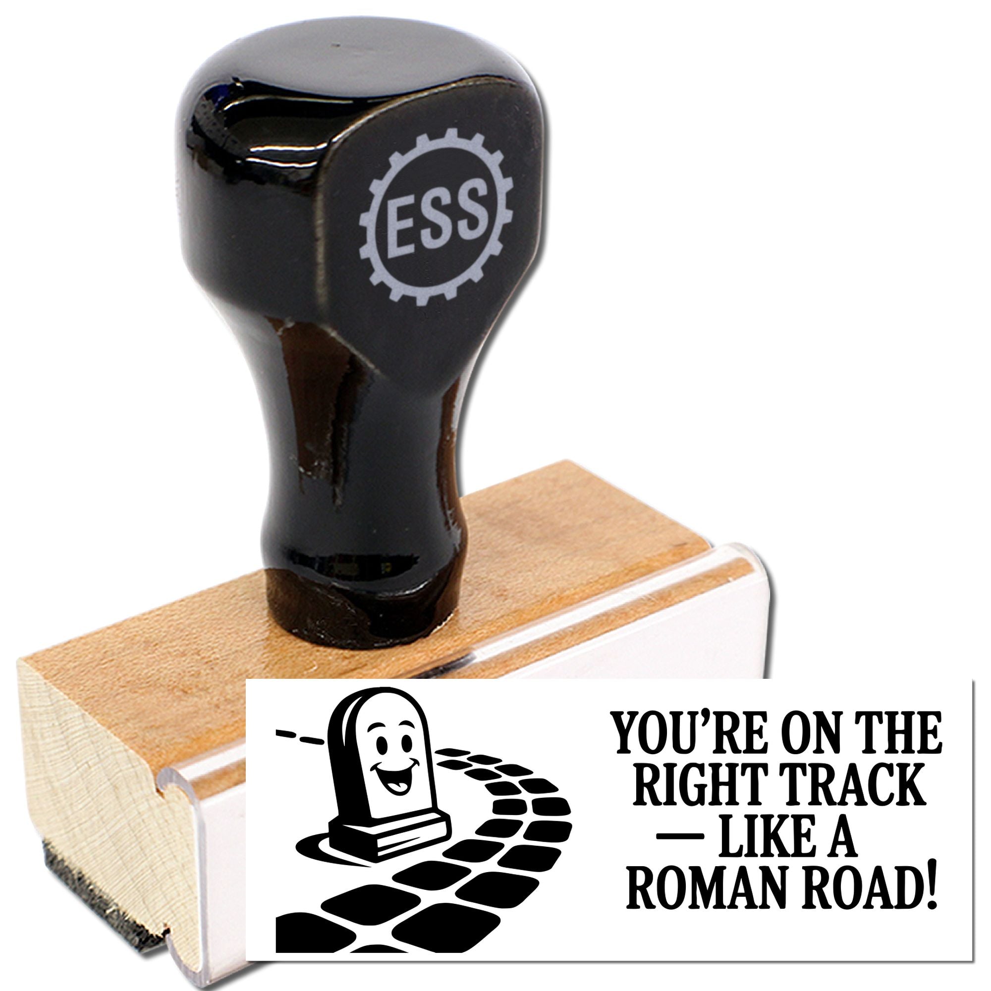 Black self-inking rubber stamp with ESS logo on wooden base, plus a sample seal reading "You're on the right track like a Roman road!"