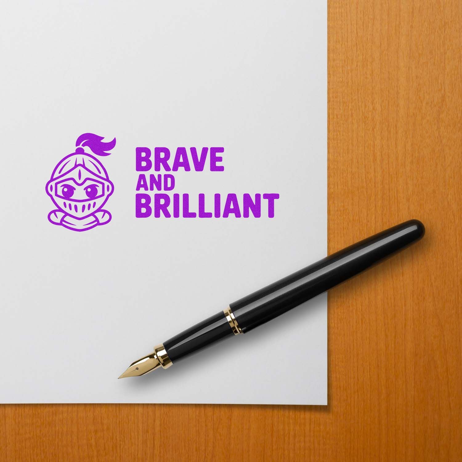 Purple Brave and Brilliant stamp seal with knight icon on white paper, beside a black fountain pen on wood desk.