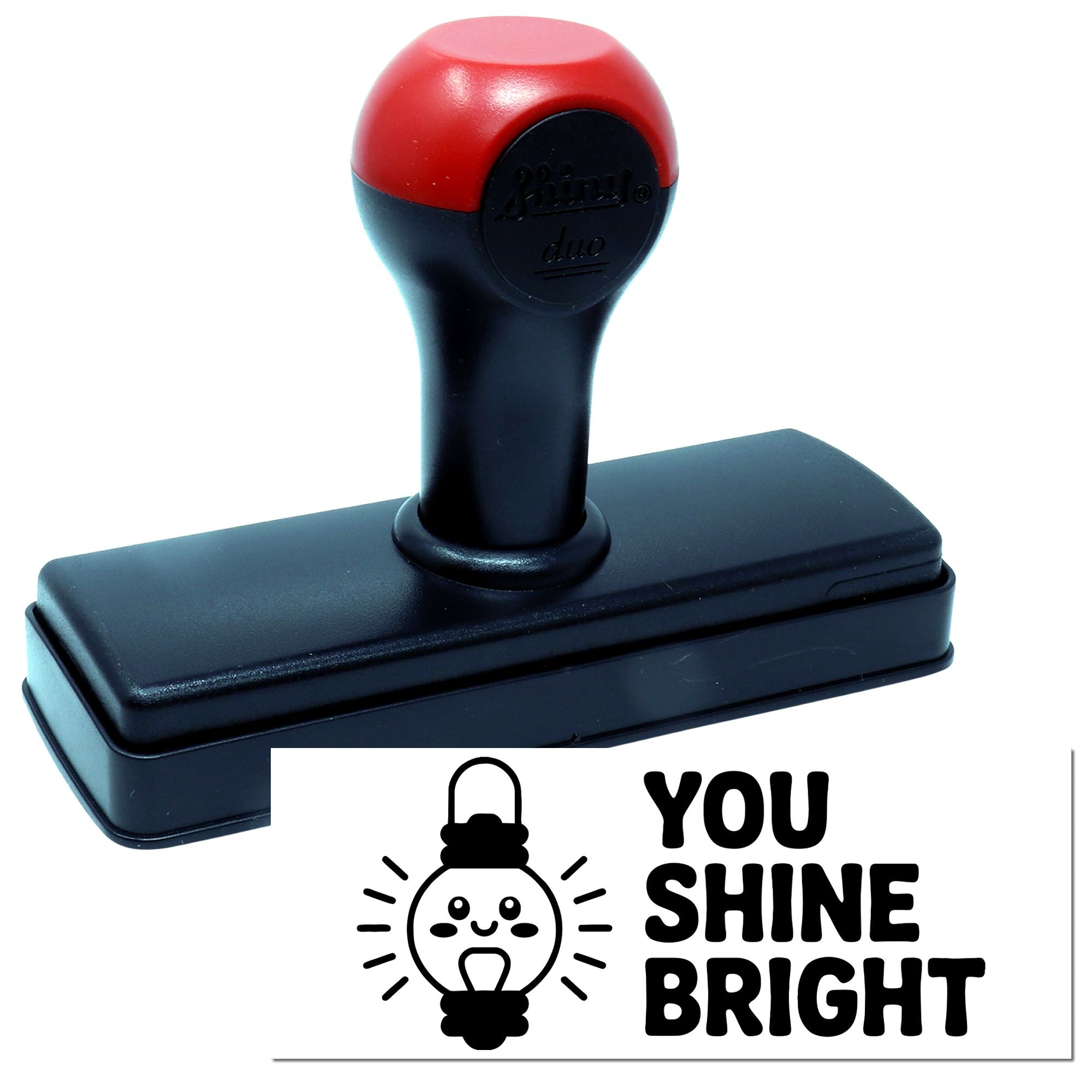 Black self-inking stamp and seal with red handle, featuring a You Shine Bright light bulb design on white.