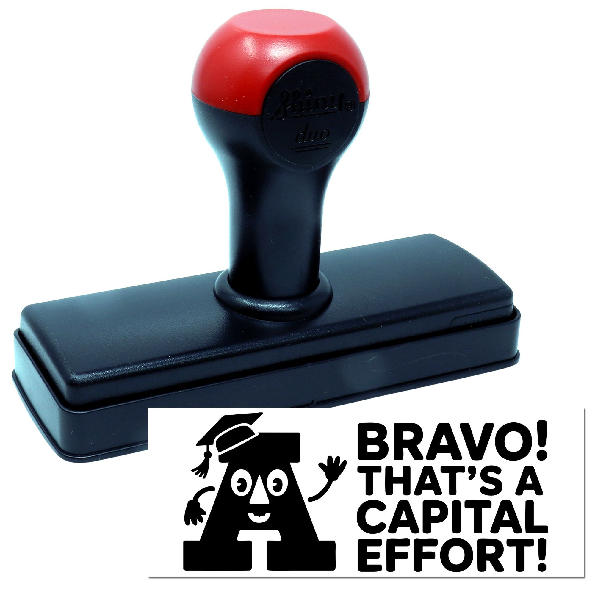 Red-and-black self-inking stamp and seal with a bold impression reading Bravo! Thats a capital effort!