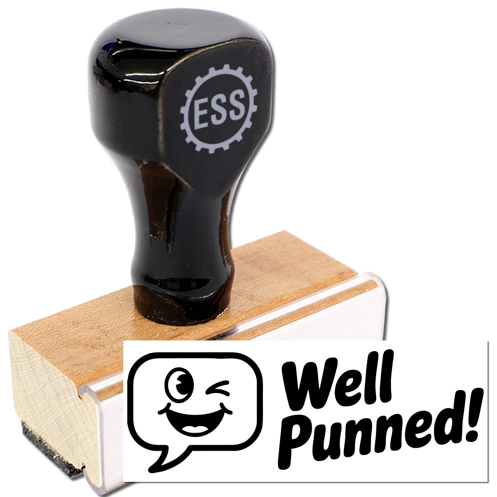 Black rubber stamp seal with ESS gear logo on wooden base, showing a Well Punned! winking face imprint.