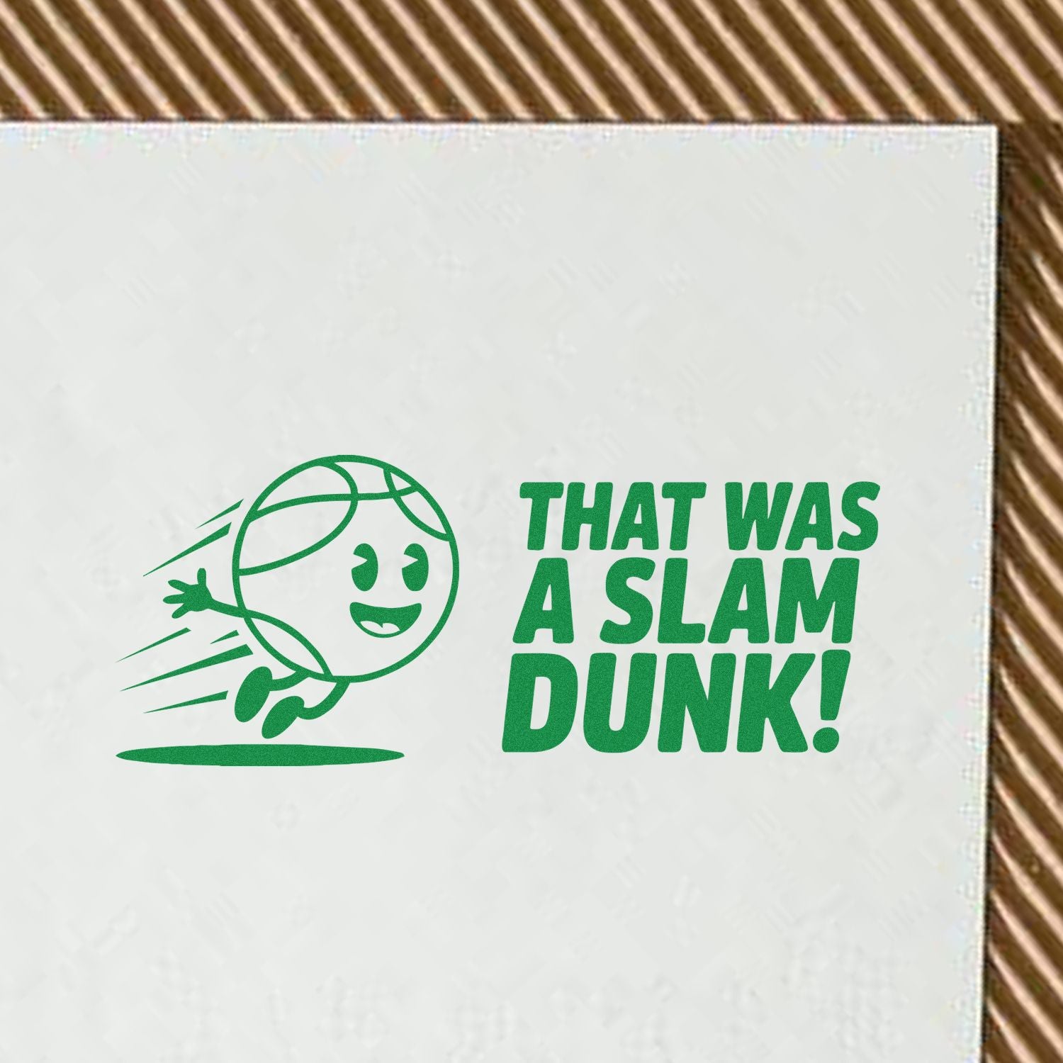 Green basketball stamp and seal design on white paper with cartoon dunking ball and That Was a Slam Dunk! text.