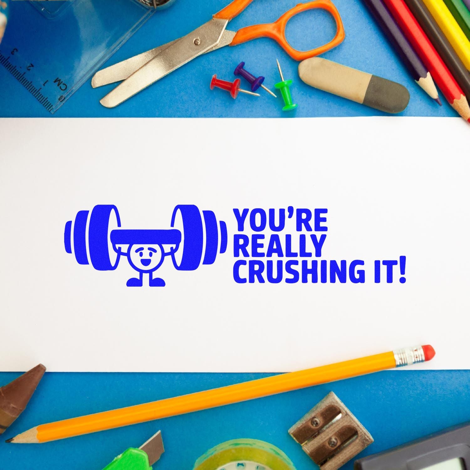 Blue stamp and seal design with weightlifter cartoon and Youre really crushing it! on a blue background with school supplies.