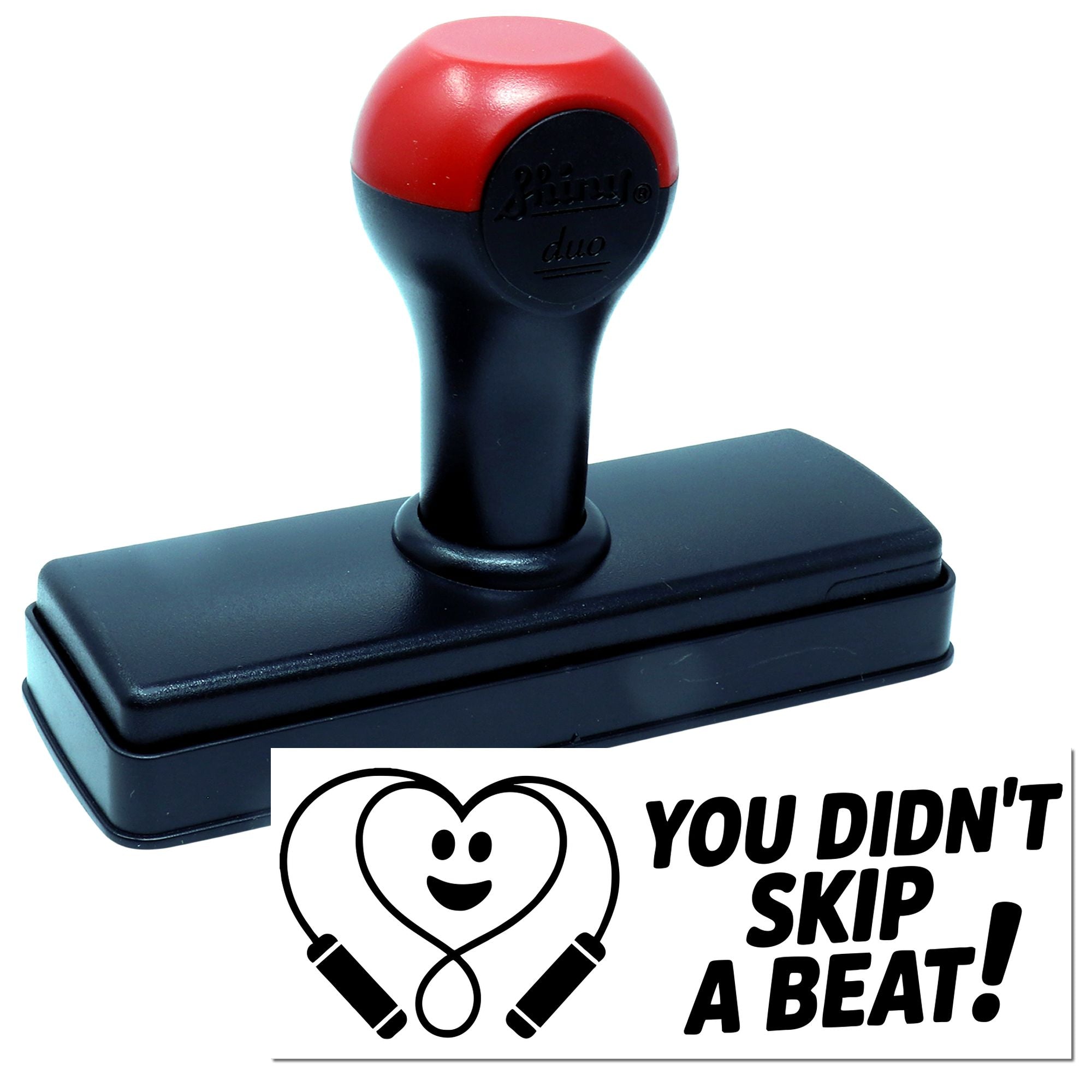 Red and black self-inking stamp and seal with heart jump rope logo and You didnt skip a beat! text.
