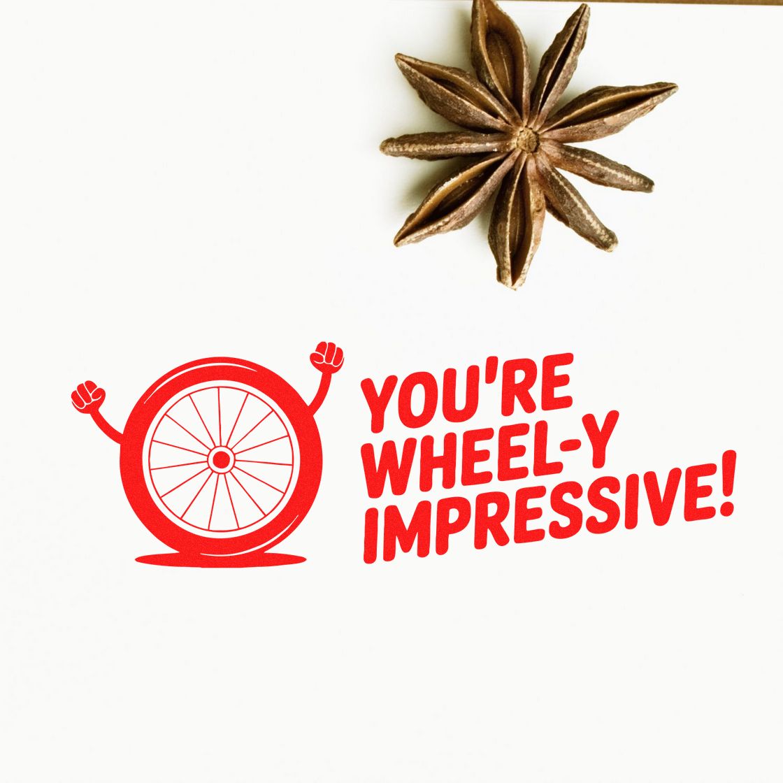 Red rubber stamp and seal reading YOURE WHEELY IMPRESSIVE! with a wheel mascot on a white background.