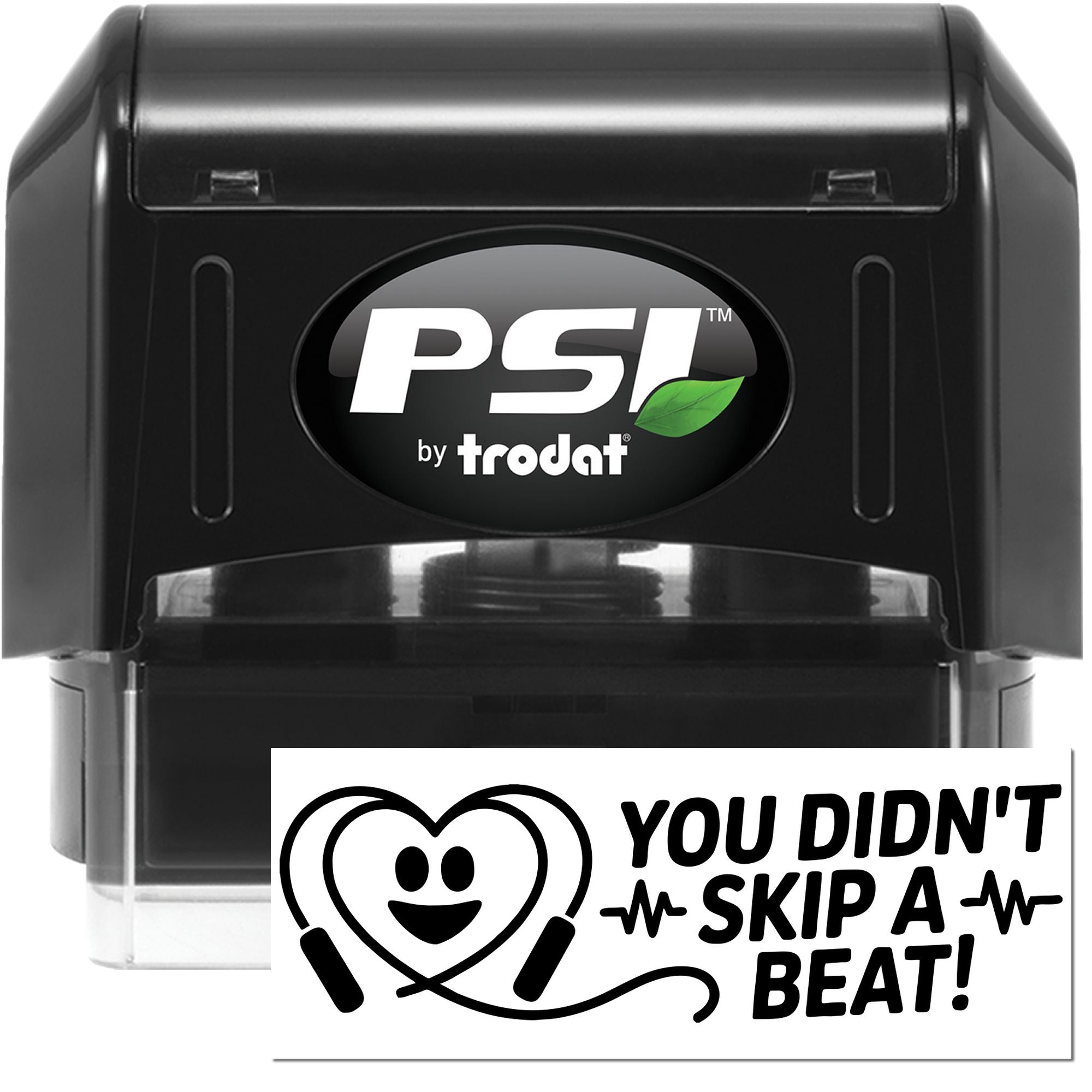 Black PSI by Trodat self-inking stamp and seal with green leaf logo and clear base, plus You Didnt Skip a Beat graphic.