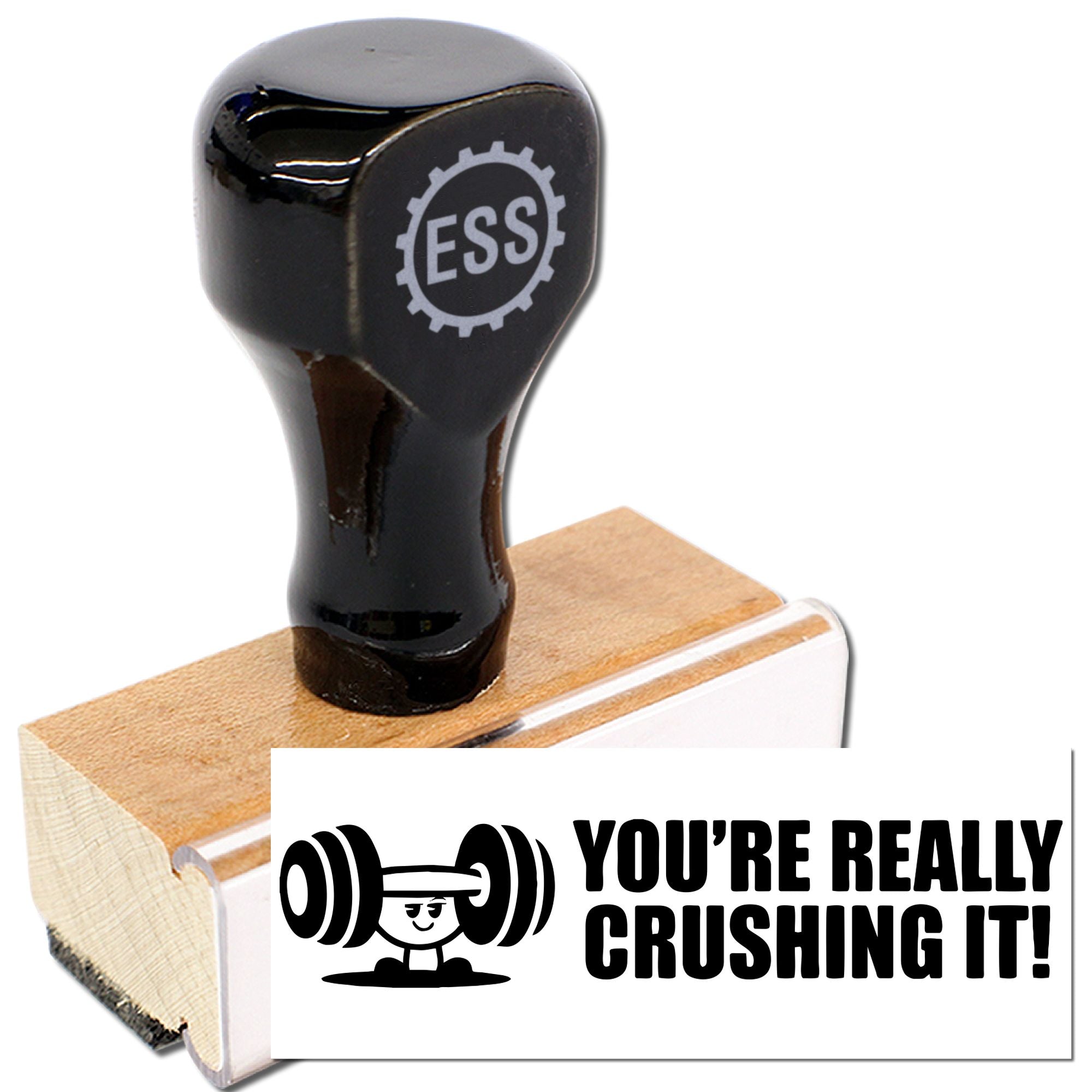 Black ESS rubber stamp on a wooden block, with a bold Youre really crushing it! seal design in black and white.