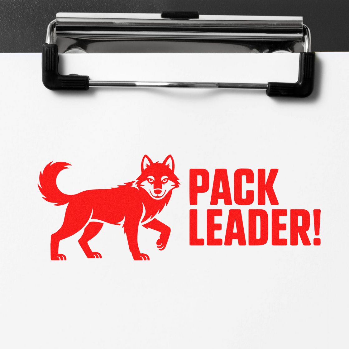 Red Pack Leader stamp seal with wolf logo on white paper clipped to a black clipboard.