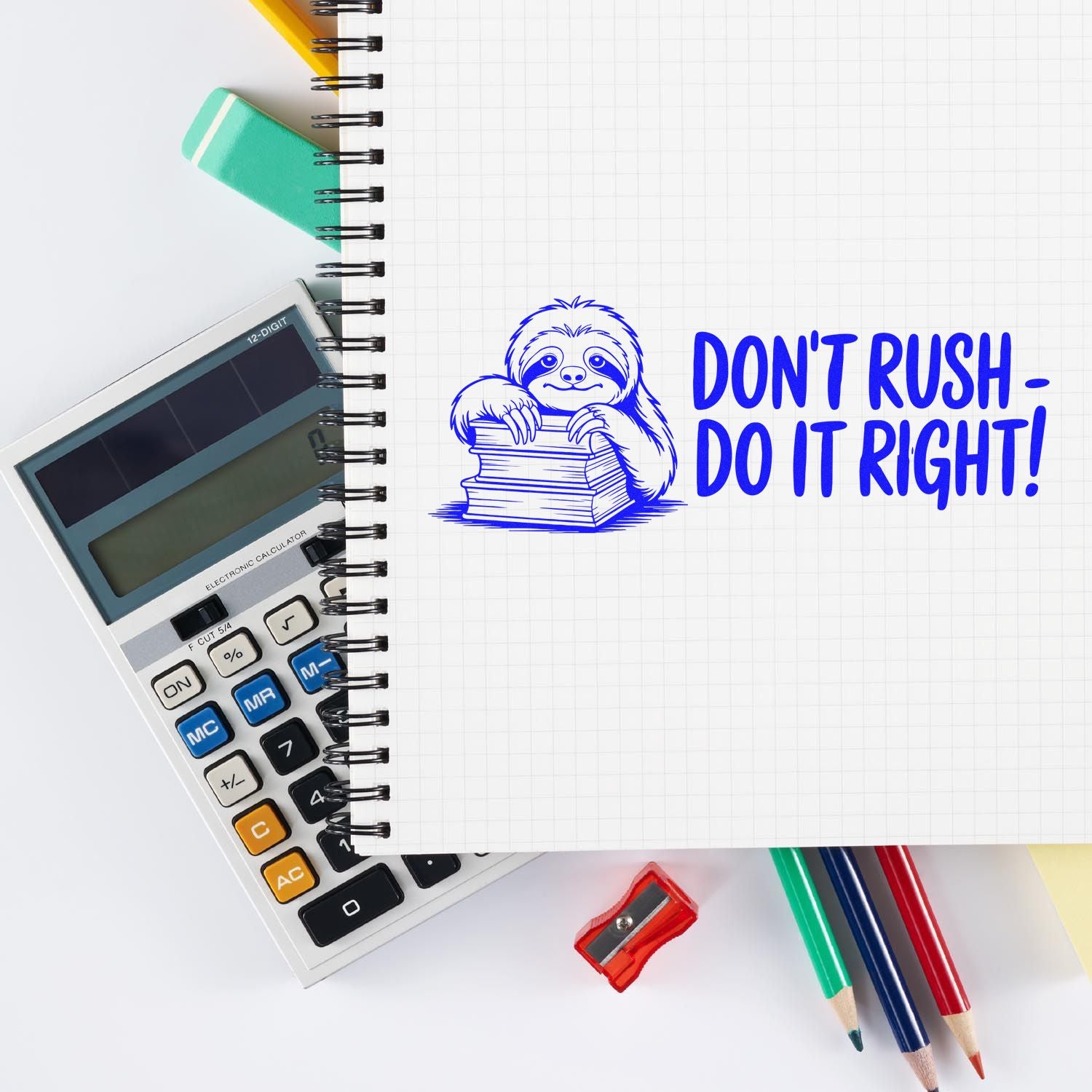 Blue sloth stamp and seal on graph notebook with DONT RUSH - DO IT RIGHT! beside calculator, pencils, and sharpener.