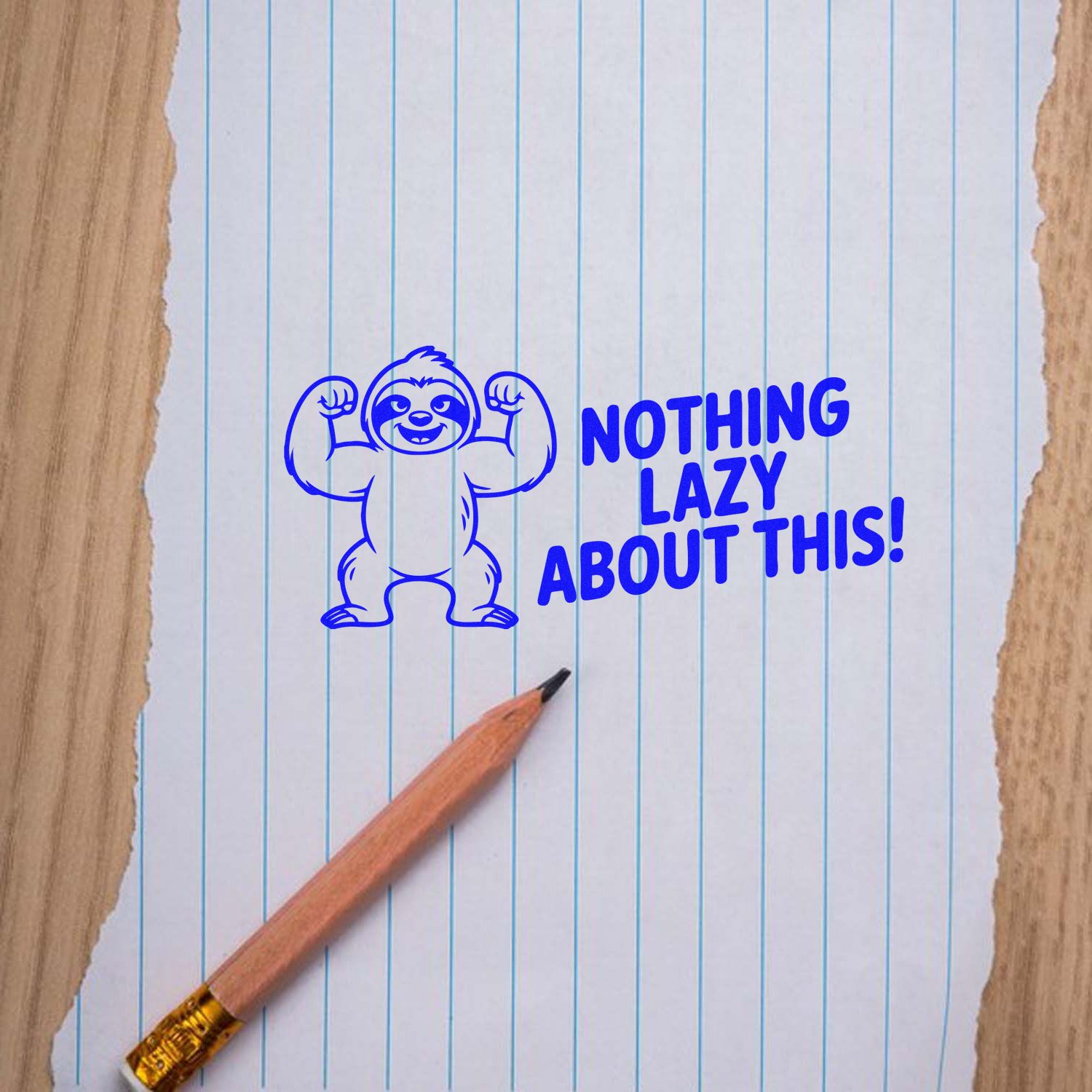 Blue stamp seal with flexing sloth and Nothing lazy about this! on lined paper beside a pencil.