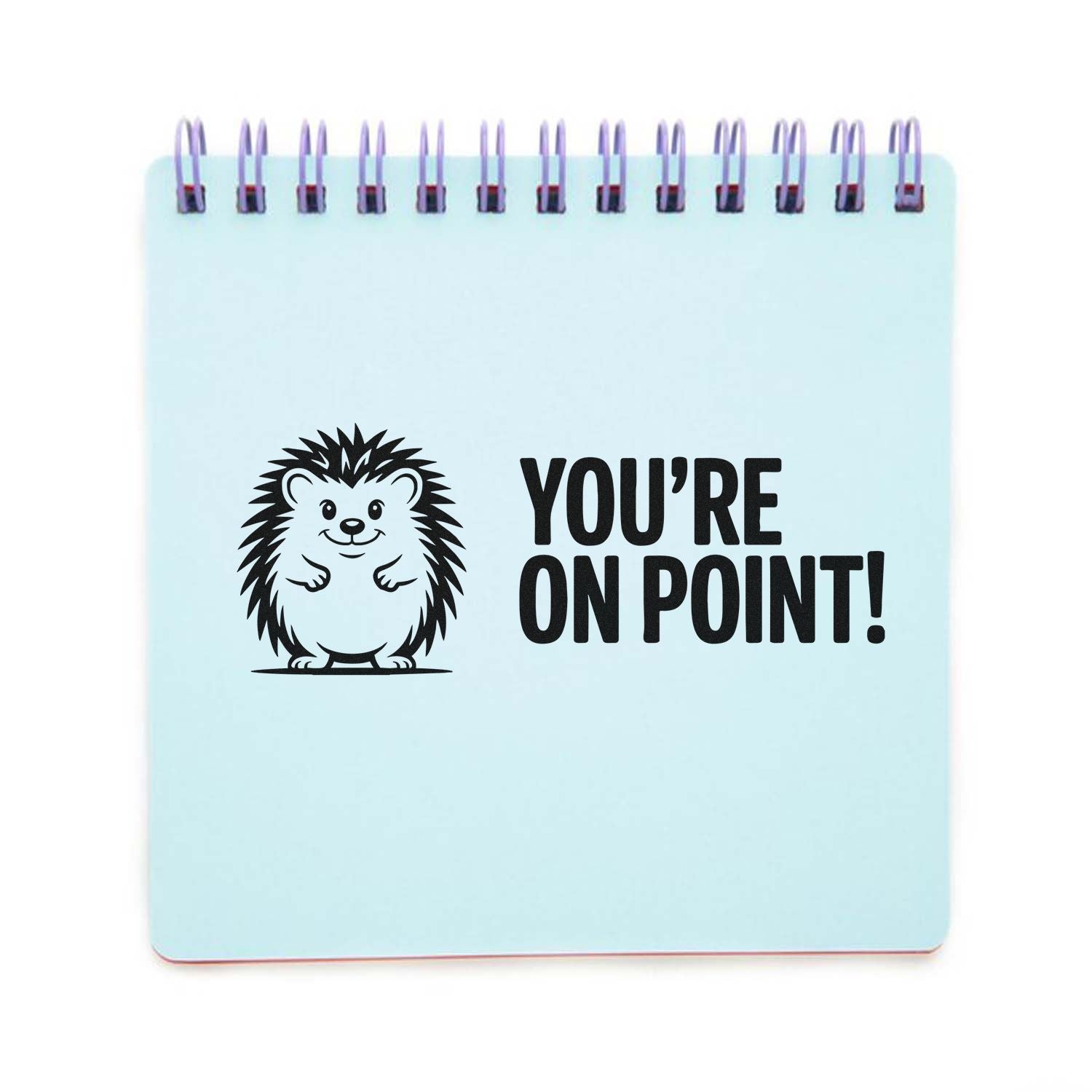 Light blue spiral-bound stamp and seal pad with black hedgehog and YOURE ON POINT! text.