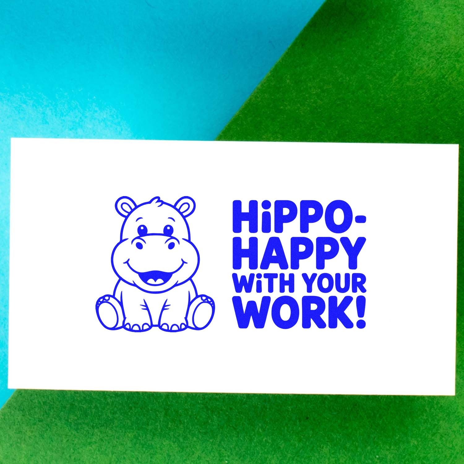 Blue hippo stamp and seal with Hippo-Happy with your work! on a white card over teal and green background.