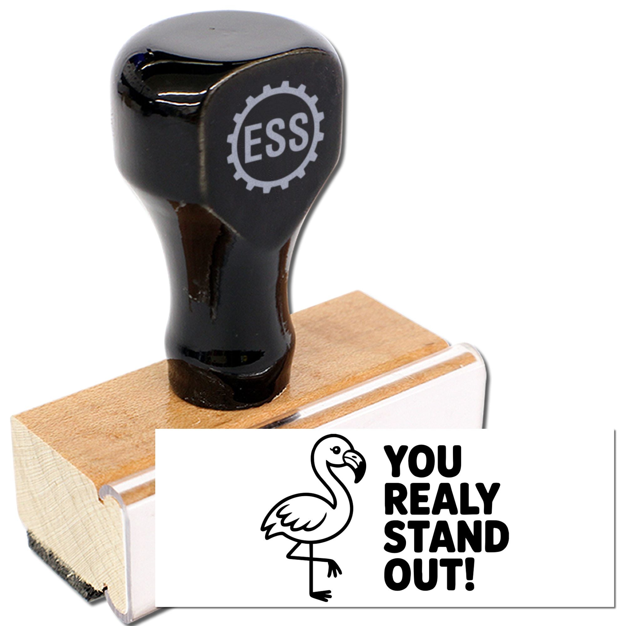 Black stamp and wooden seal with ESS logo, plus white flamingo design reading You really stand out!
