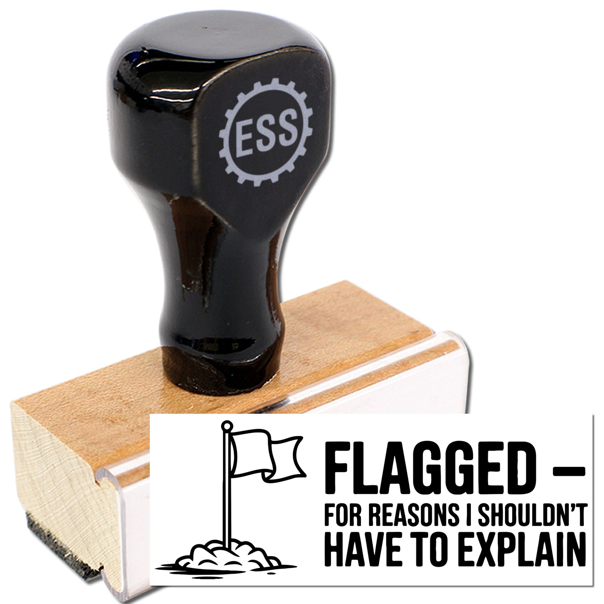 Black rubber stamp seal with ESS logo on wood base beside white card reading FLAGGED - for reasons I shouldnt have to explain