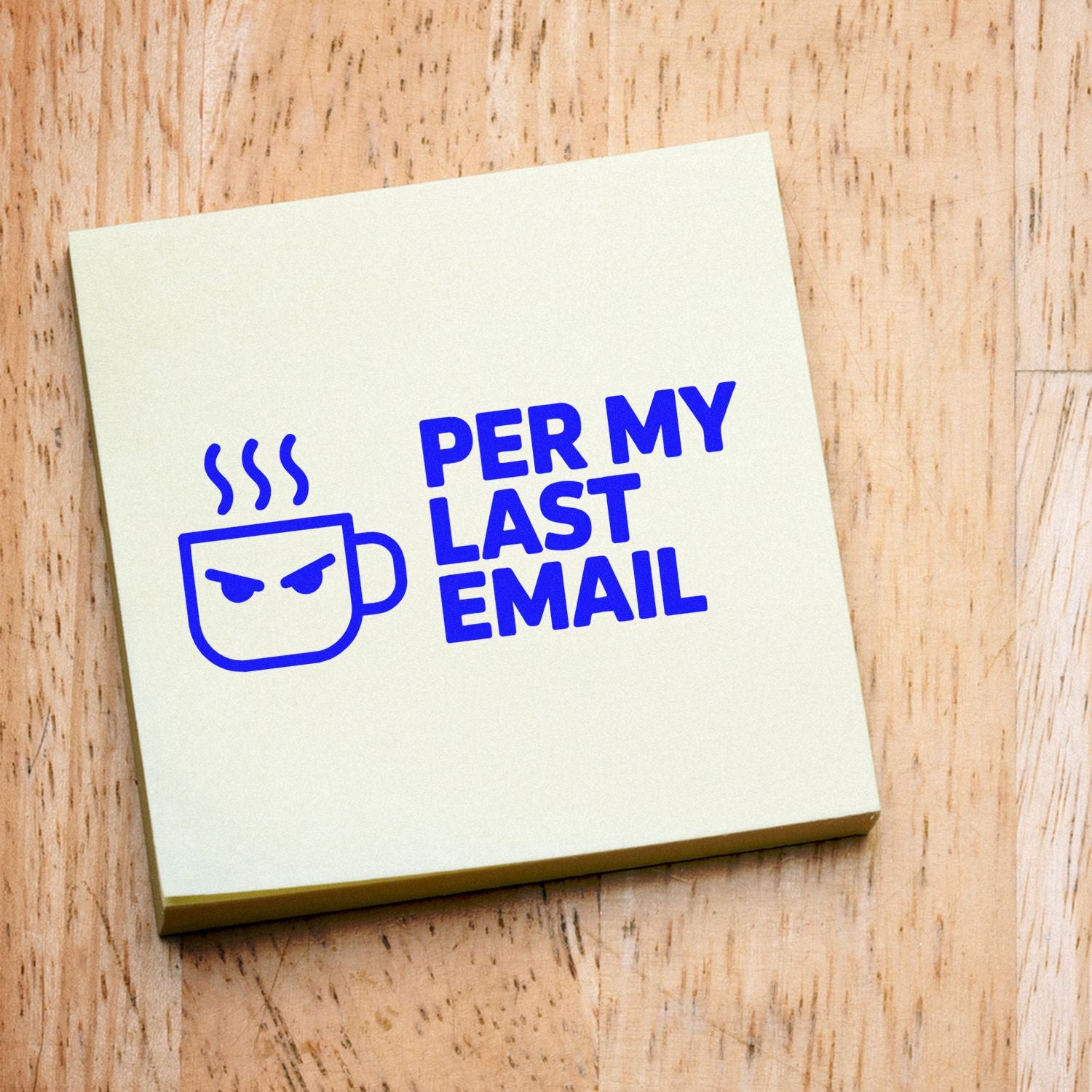 Cream stamp and seal block with blue angry coffee mug and PER MY LAST EMAIL on wood.