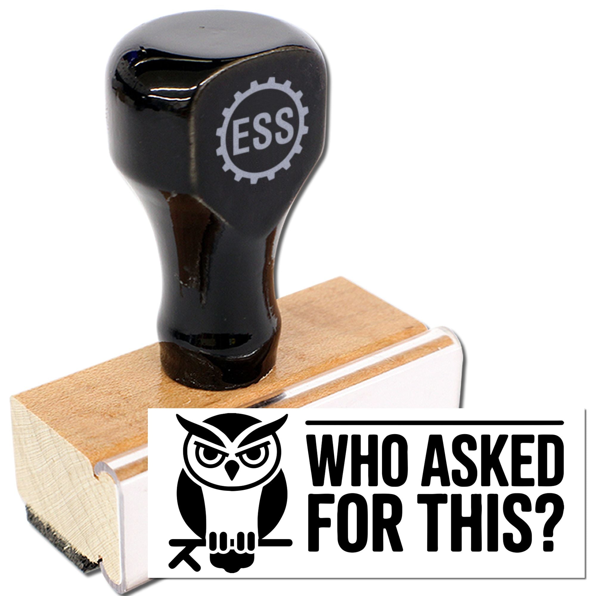 Black rubber stamp and wooden seal with owl graphic, white label, and Who Asked For This? text