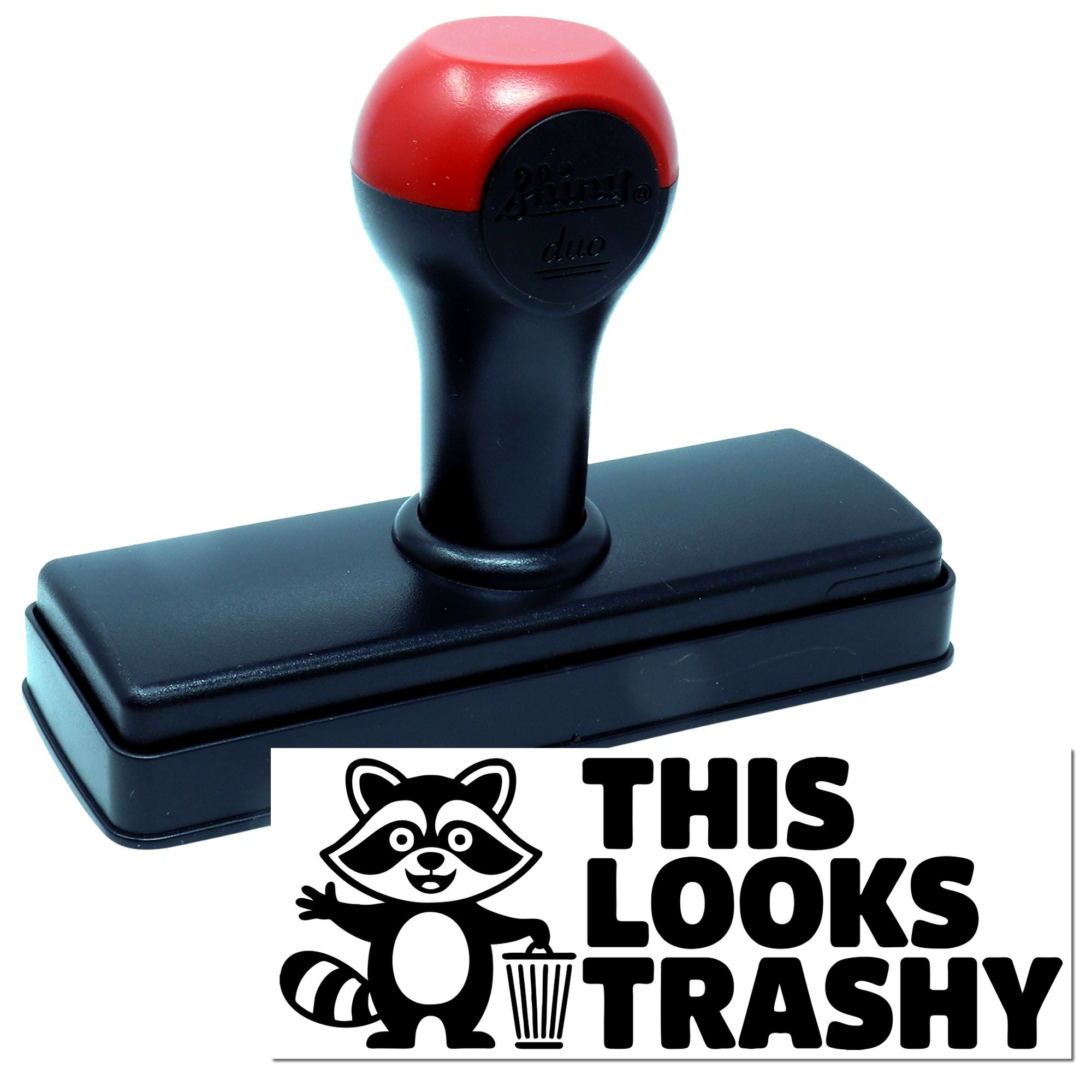 Black self-inking stamp with red handle and raccoon THIS LOOKS TRASHY seal design on a white background.