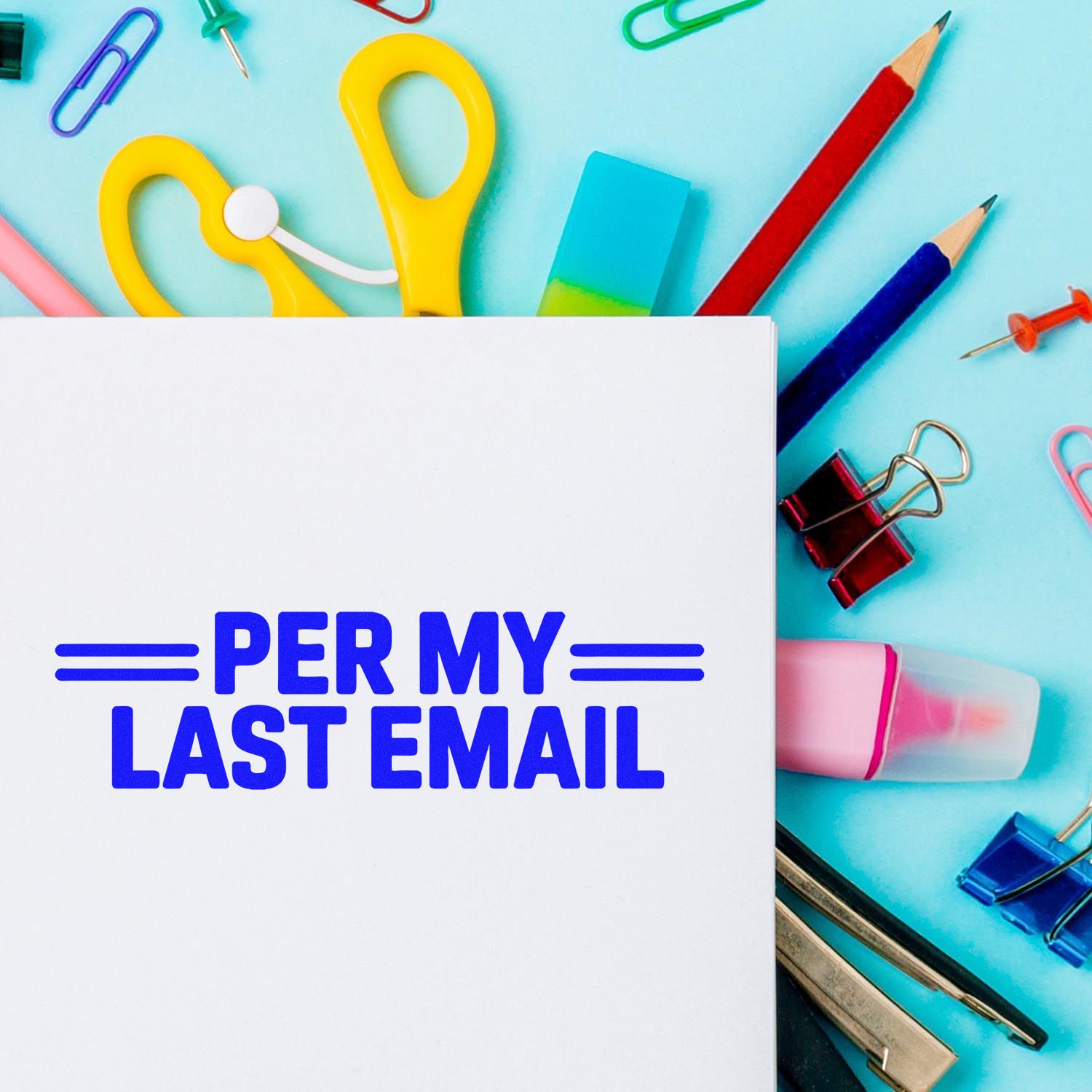 White stamp card with blue PER MY LAST EMAIL text, surrounded by colorful office supplies, clips, and stamp-and-seal products.