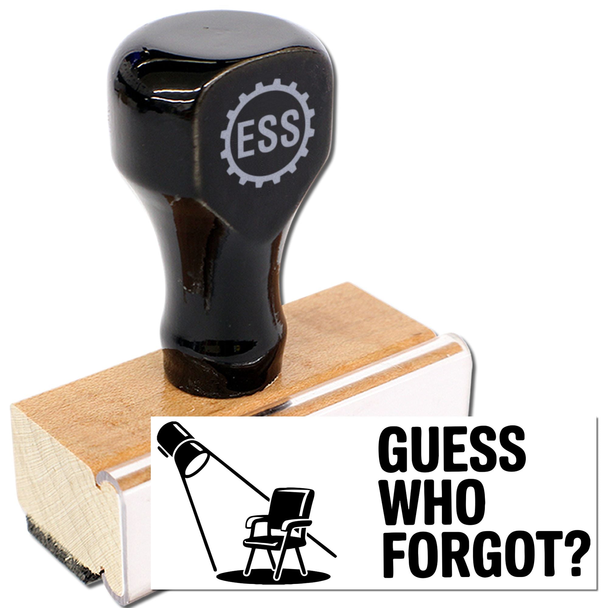 Black self-inking stamp seal with ESS gear logo on wooden base, beside a white GUESS WHO FORGOT? card.