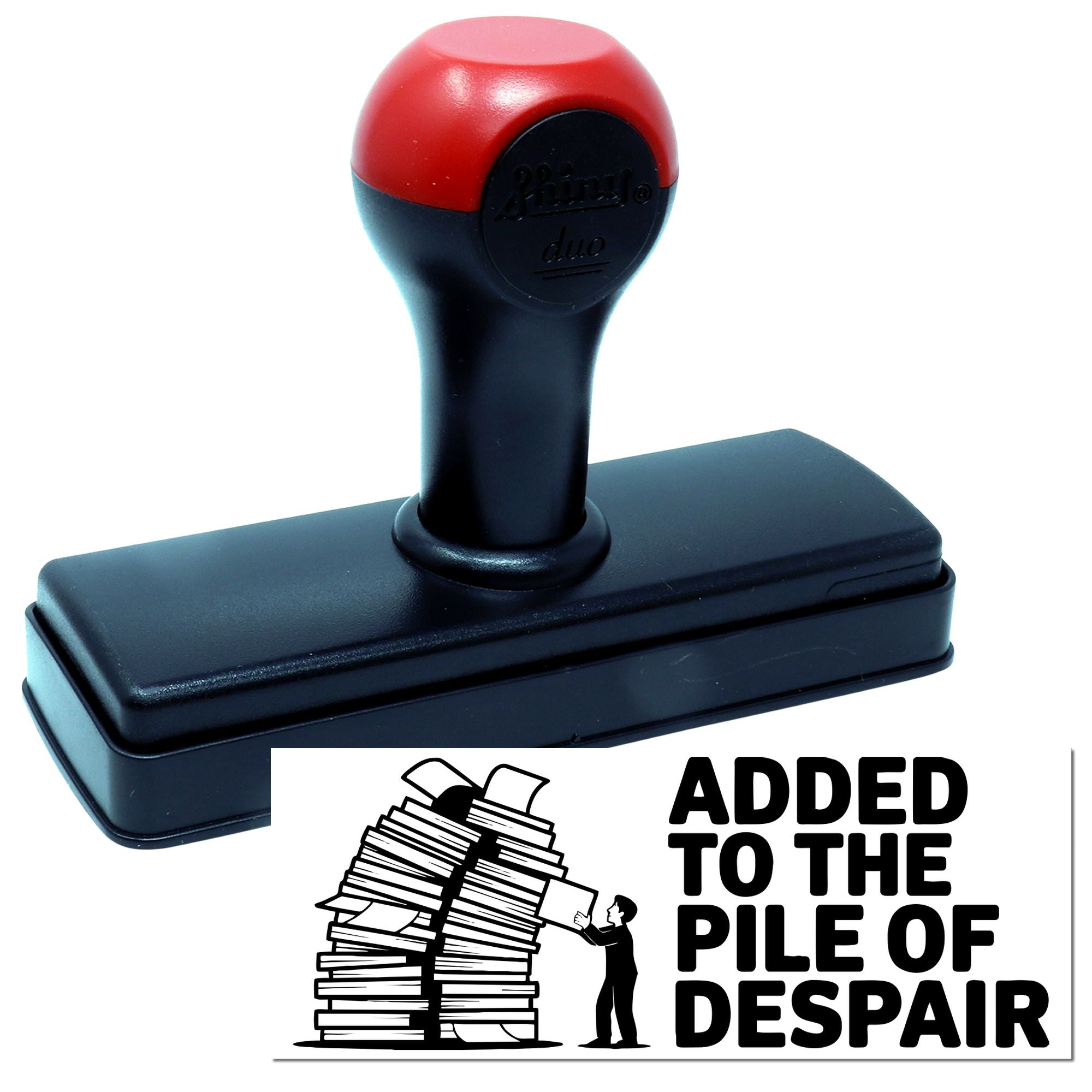 Red and black self-inking stamp and seal with rectangular base, featuring Added to the Pile of Despair graphic.
