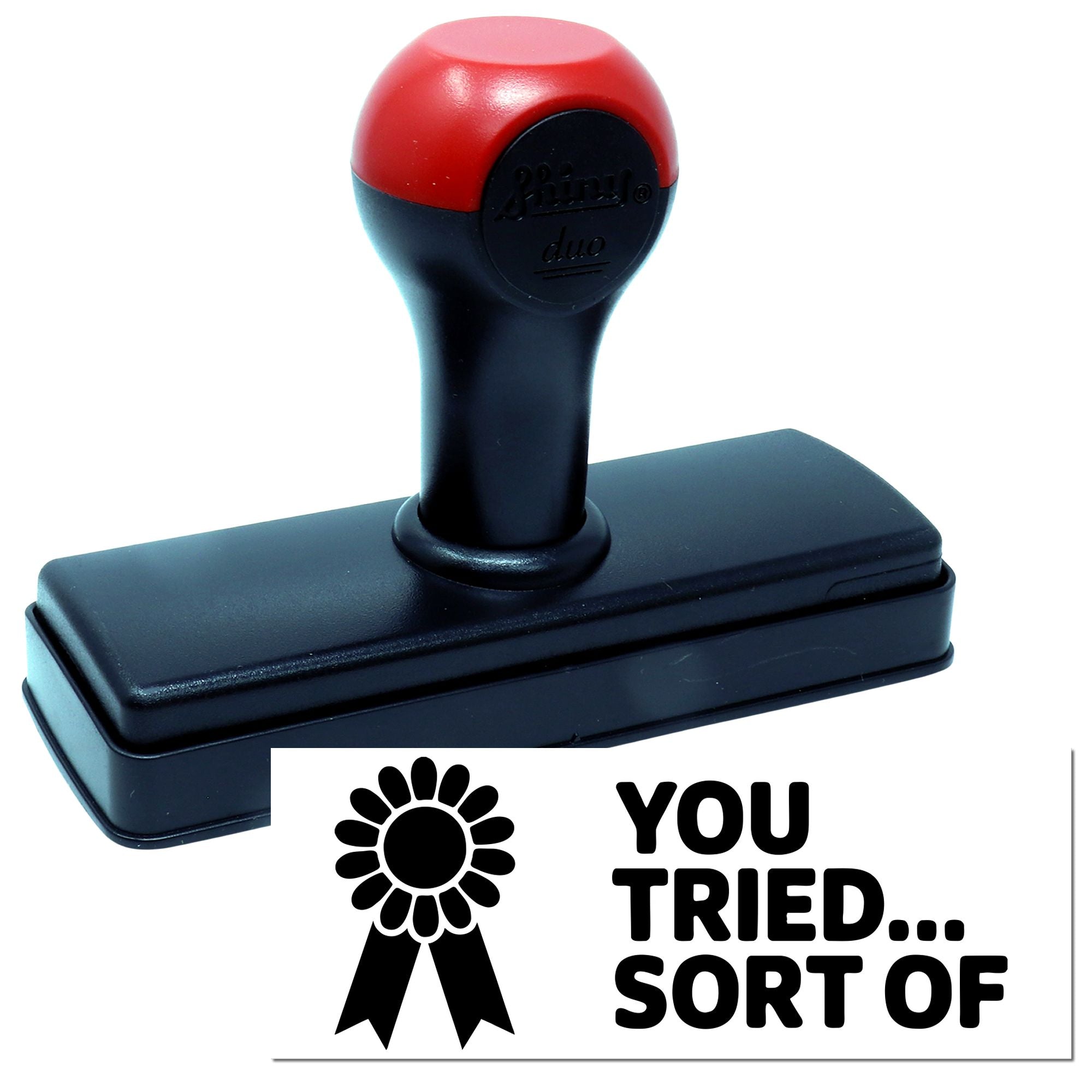 Red and black self-inking stamp and seal with YOU TRIED... SORT OF text and award ribbon graphic.