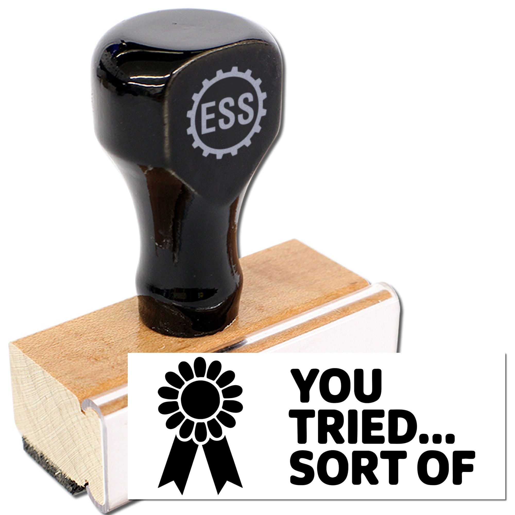 Black ESS rubber stamp on wooden block with white seal reading You tried... sort of and rosette icon