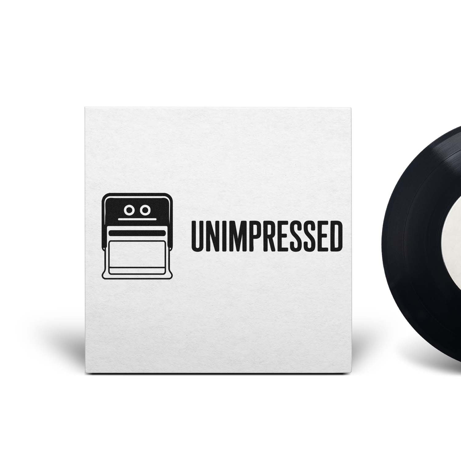 White rubber stamp and seal with black UNIMPRESSED text and simple face icon; partial black circular seal at right.