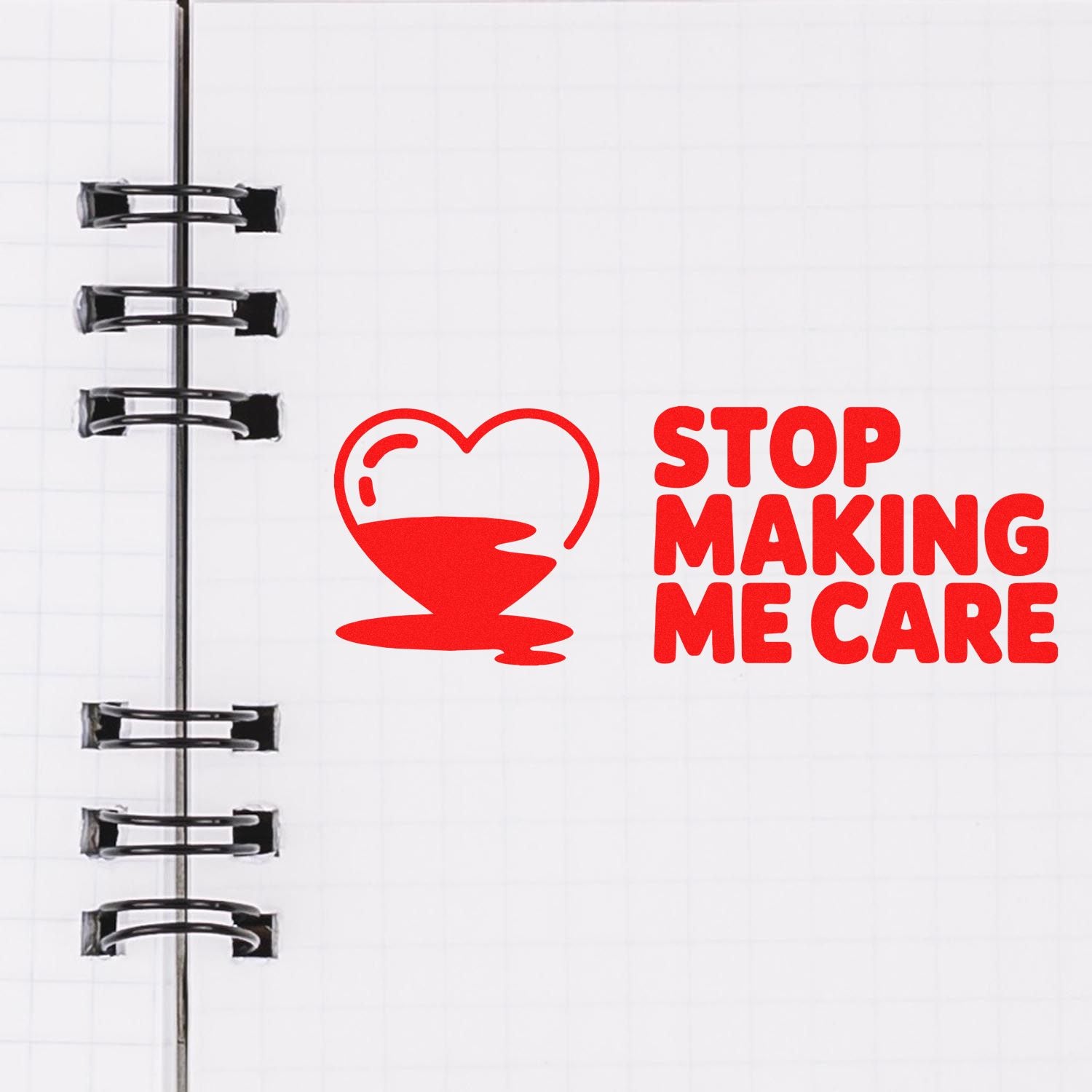 Red stamp and seal design with heart coffee cup icon and bold STOP MAKING ME CARE text on a white notebook page.