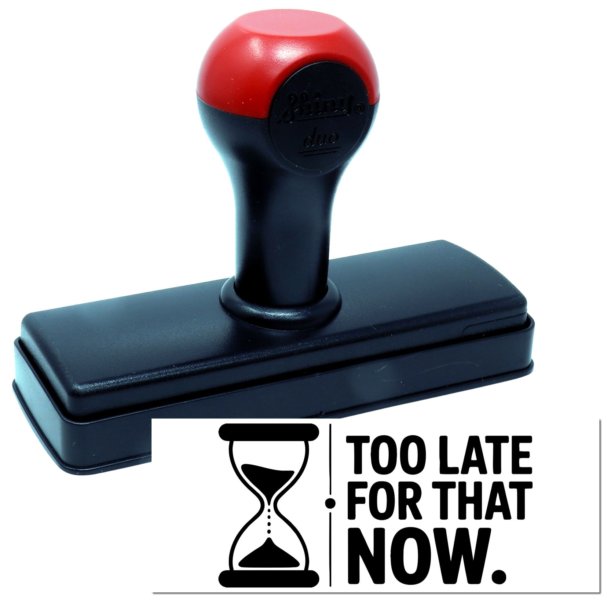 Red and black self-inking stamp and seal with rectangular base and hourglass icon, reading Too late for that now.