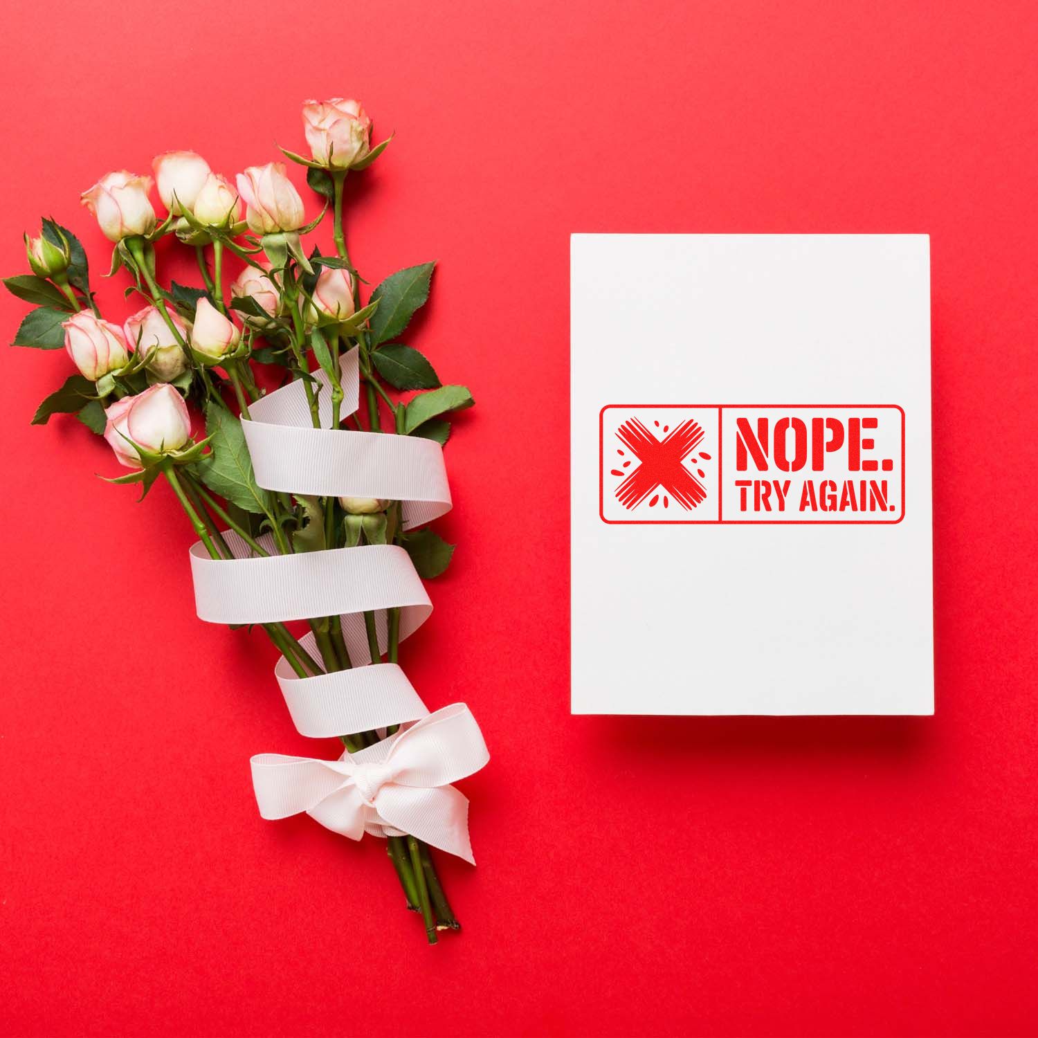 Pink roses wrapped in white ribbon beside a white card with a red NOPE. TRY AGAIN. stamp seal on a red background.