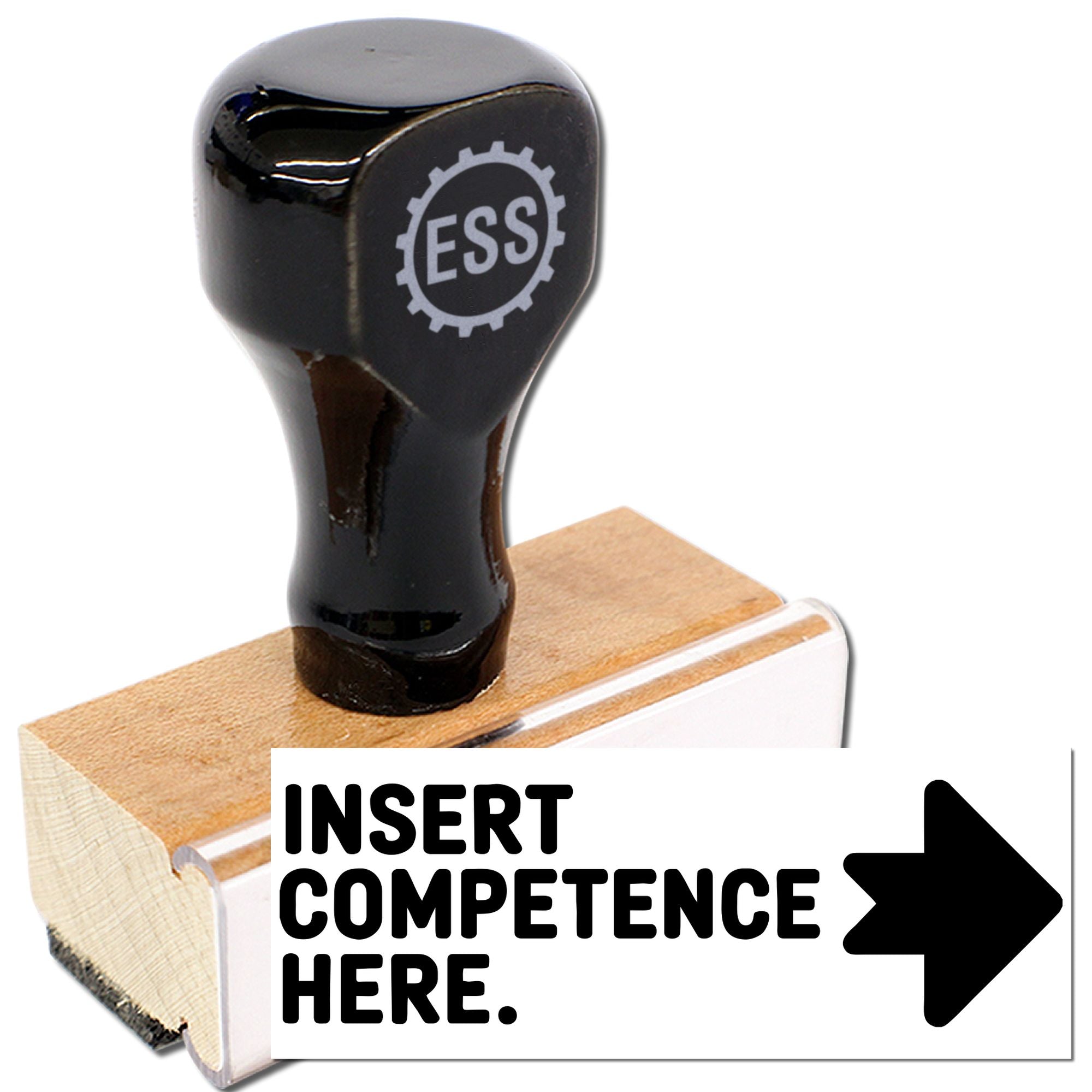 Black ESS rubber stamp and seal on a wooden base with a white insert card reading INSERT COMPETENCE HERE and a bold right arrow.