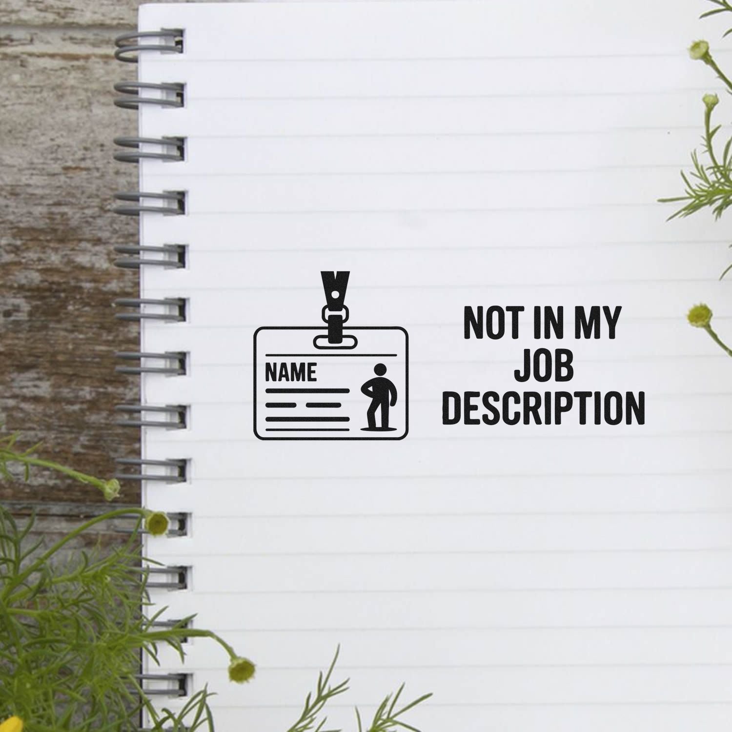 Black stamp and seal design on white notebook page with ID badge icon and Not in My Job Description text.