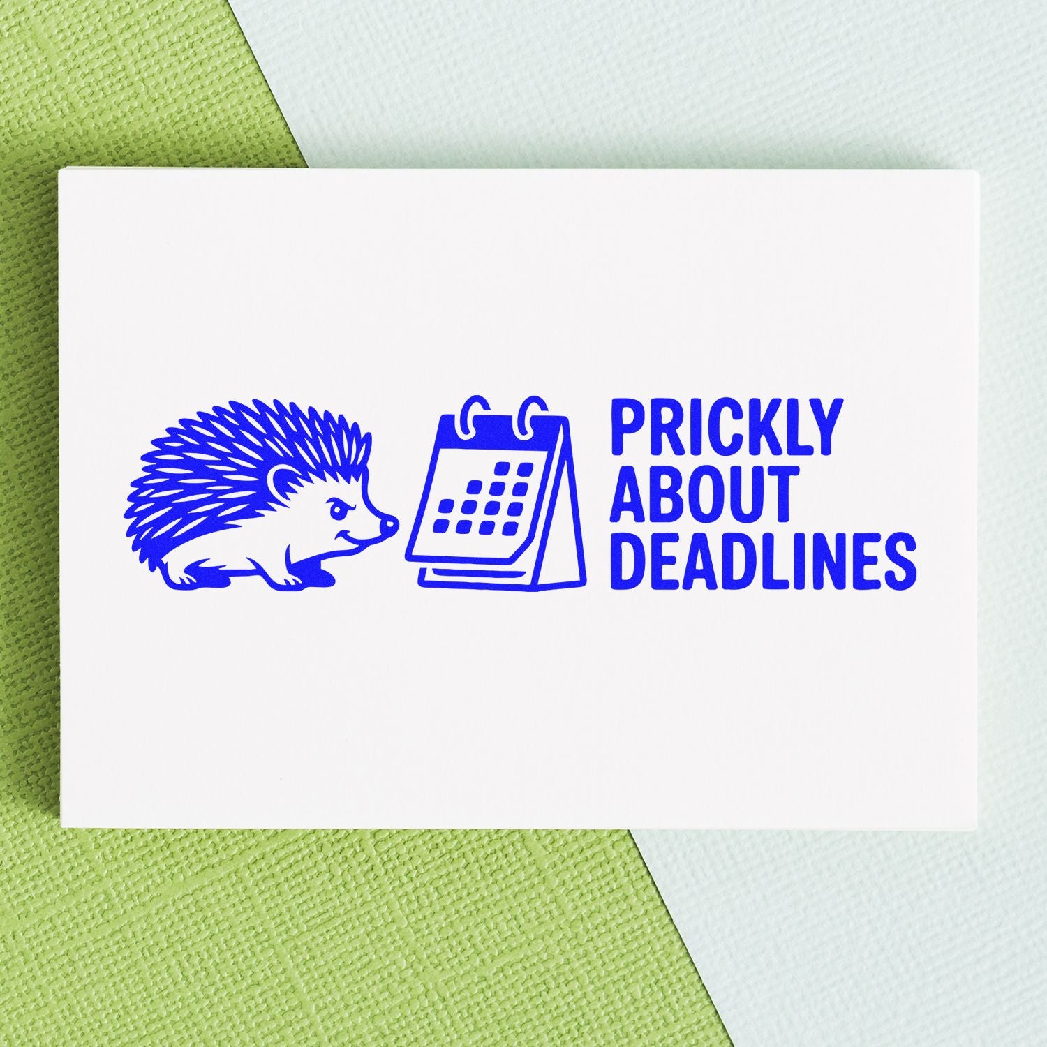Blue stamp seal featuring a hedgehog and calendar with Prickly About Deadlines on a white card over green and white background.