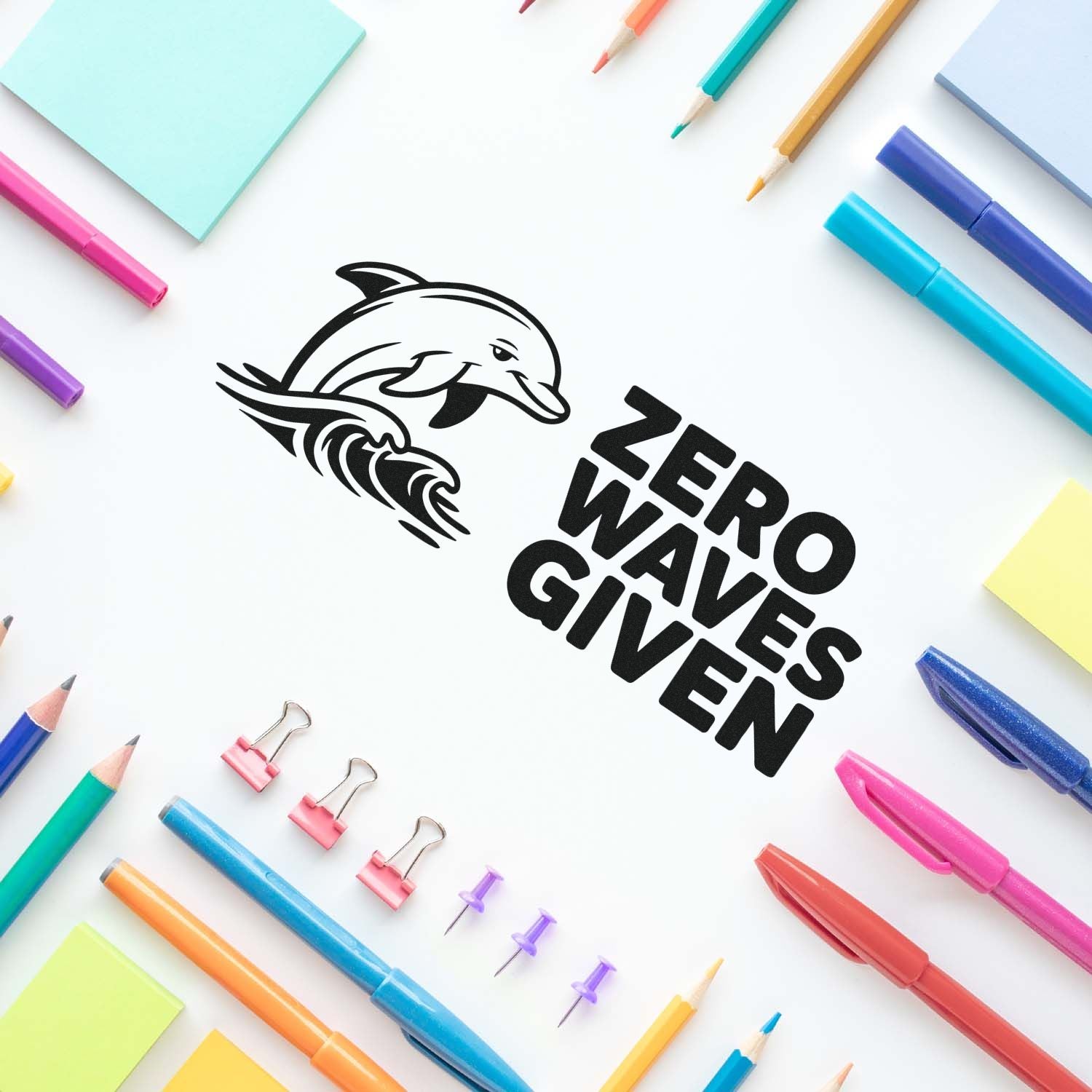 Black ZERO WAVE GIVEN stamp seal with dolphin logo, surrounded by colorful pens, pencils, sticky notes, and binder clips.