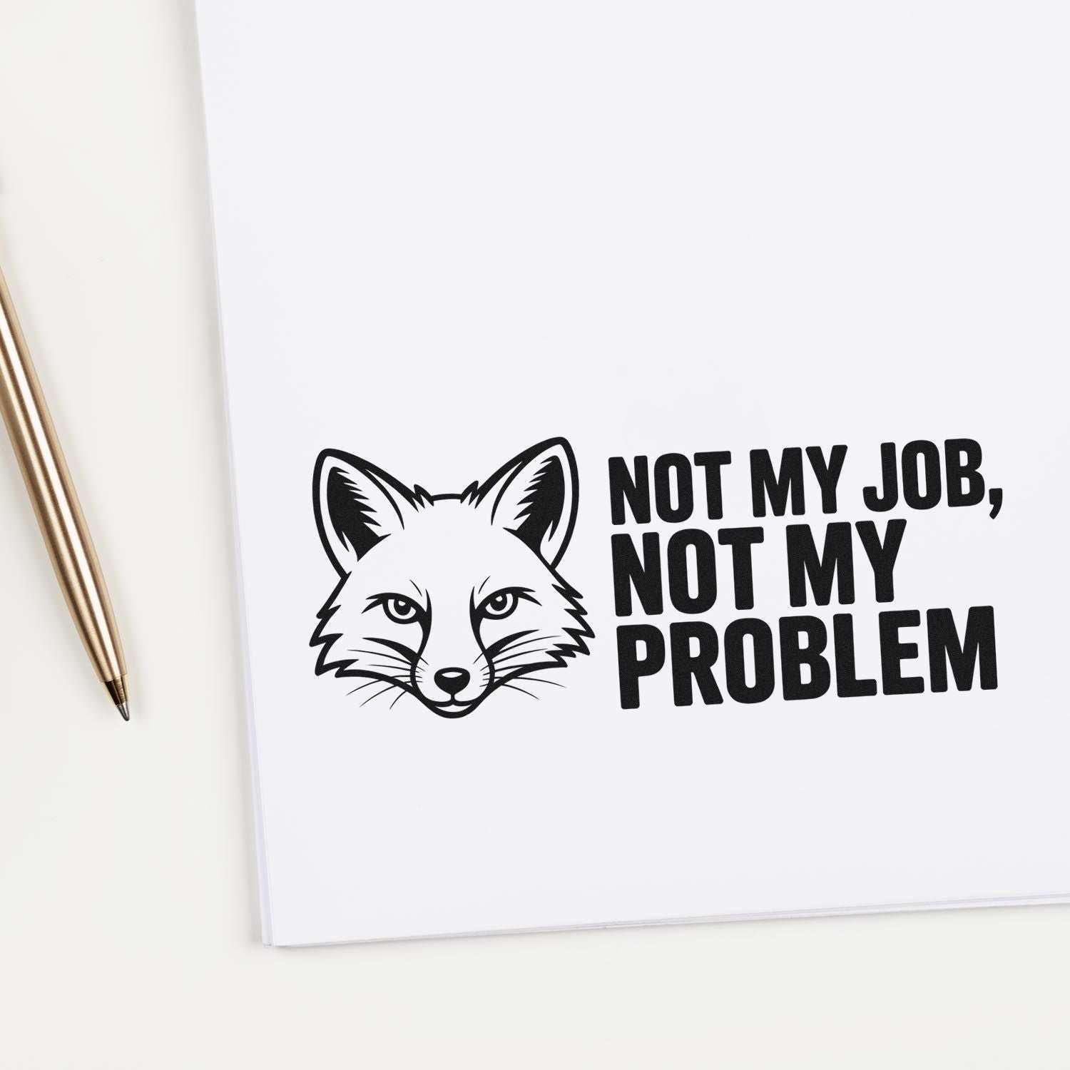 Black fox stamp and seal design with bold Not My Job, Not My Problem text on white background, beside a gold pen.