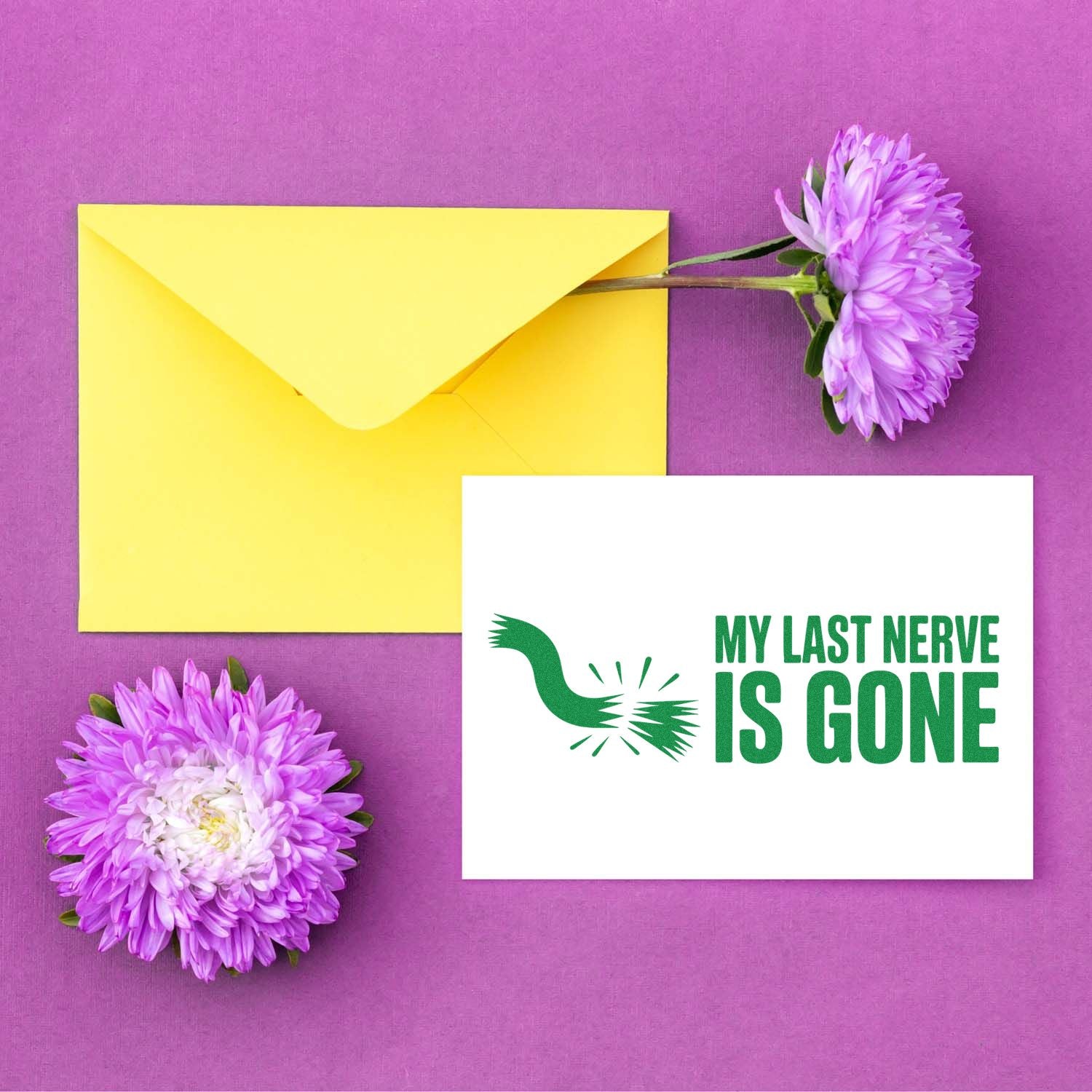 Yellow envelope and purple flowers beside a white stamp-and-seal card with green MY LAST NERVE IS GONE text and broken seal graphic.